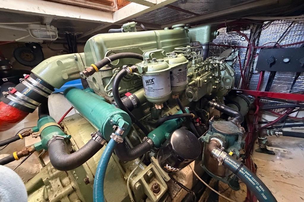 Engine room of a 1976 Grand Banks 32 Sedan, showcasing detailed mechanical components.