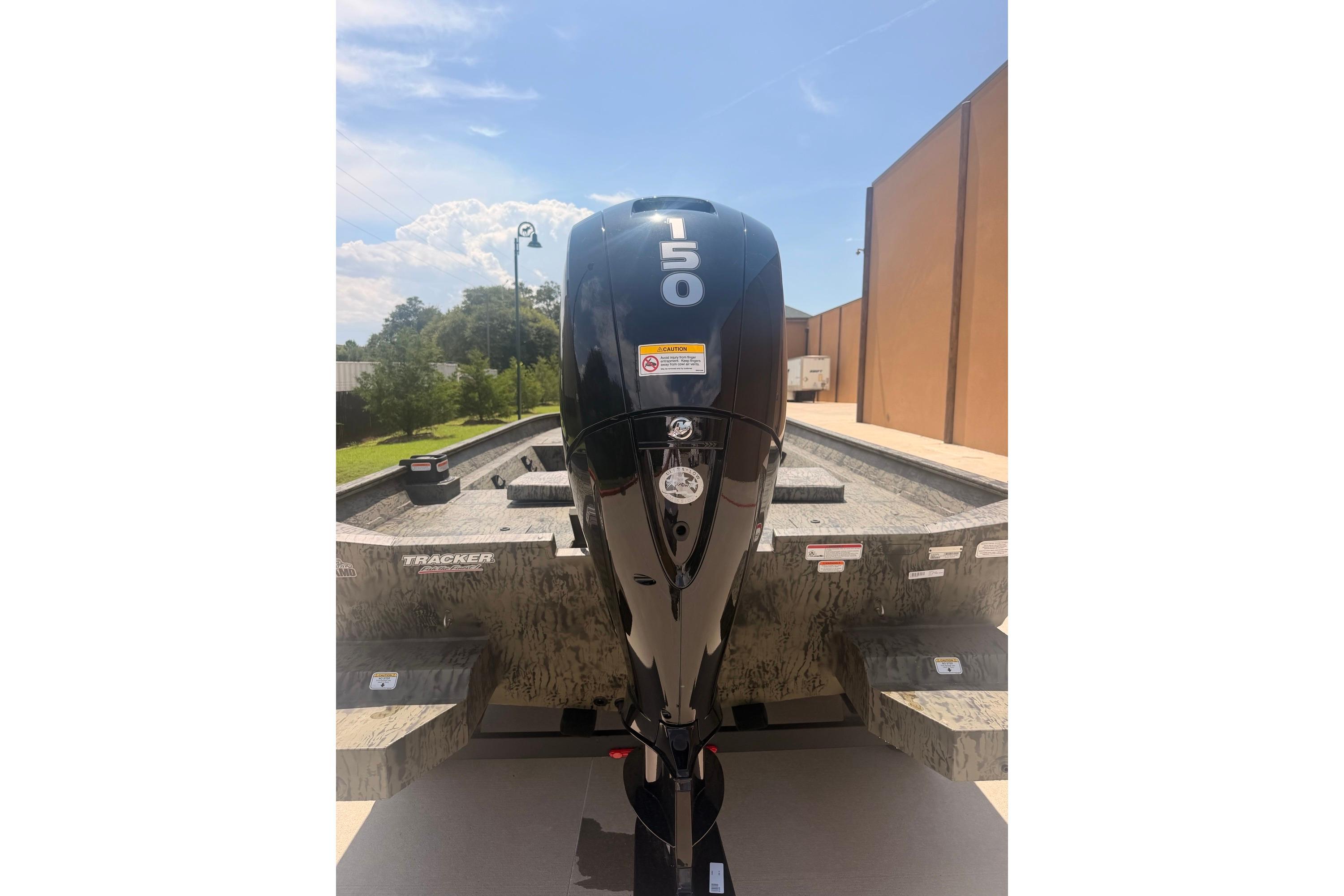2026 Tracker Grizzly 2072 CC boat with powerful 150 HP outboard motor.