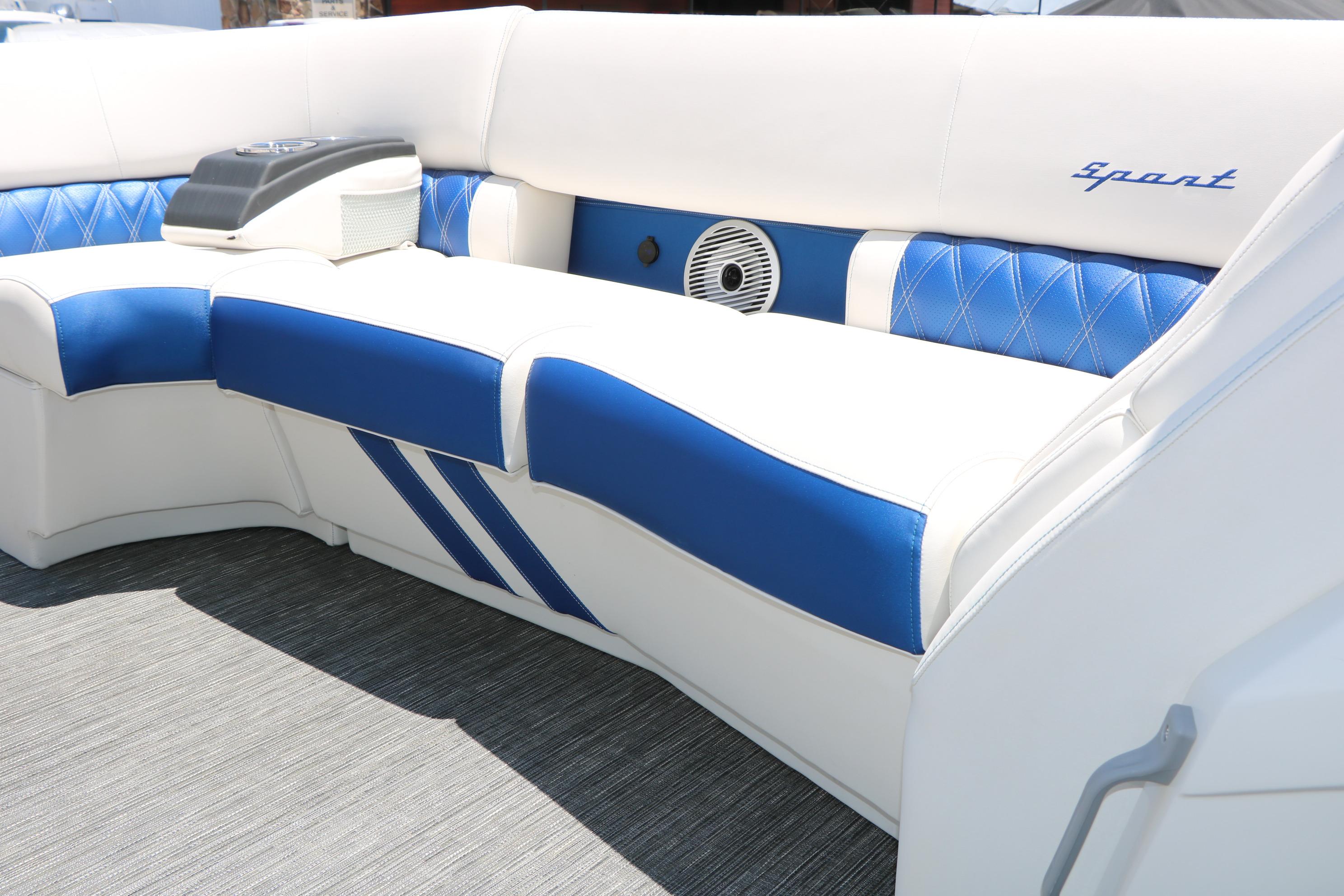 2024 Bennington 23 RX SWINGBACK boat interior with blue and white seating.