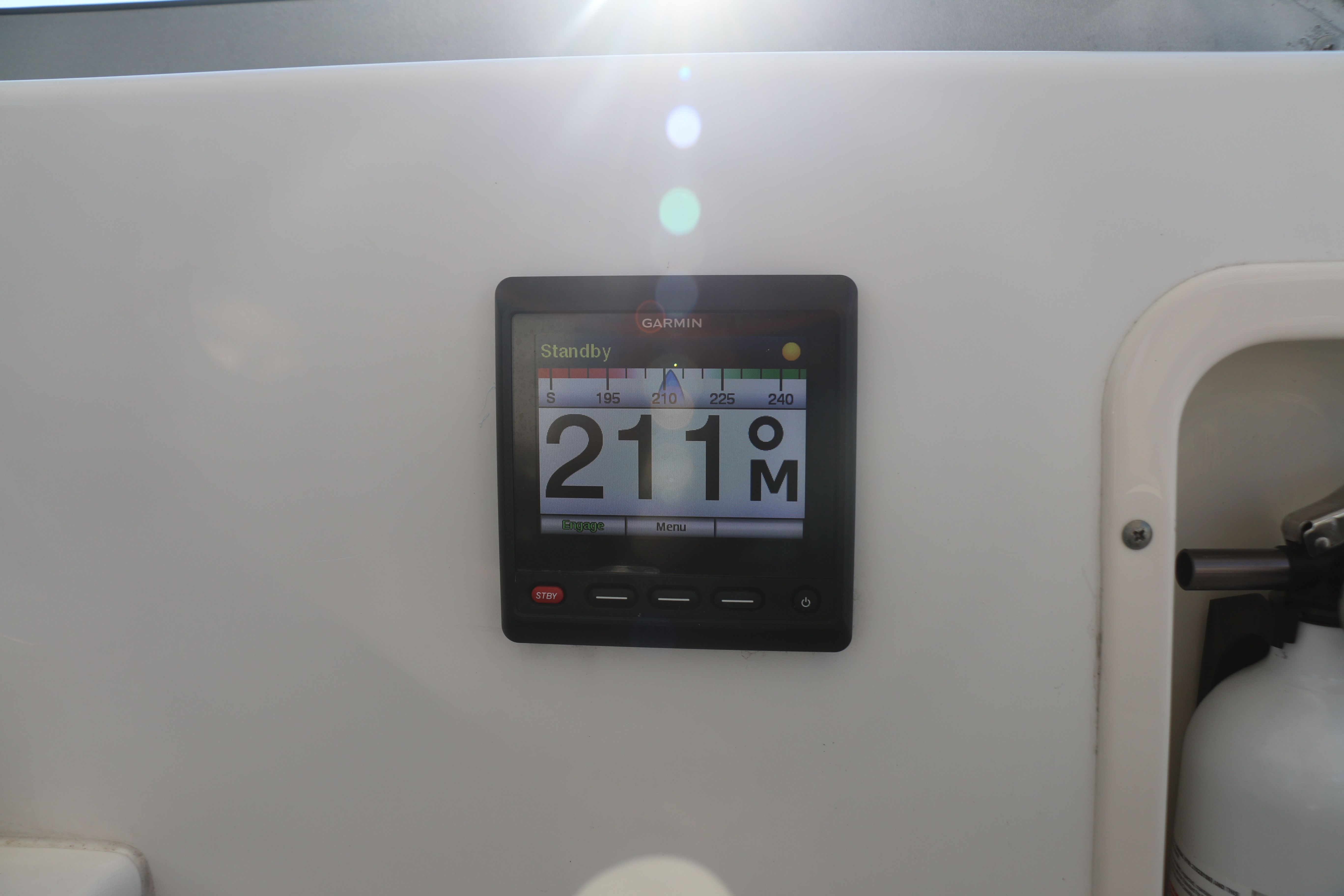 Garmin navigation system on a boat displaying course heading.