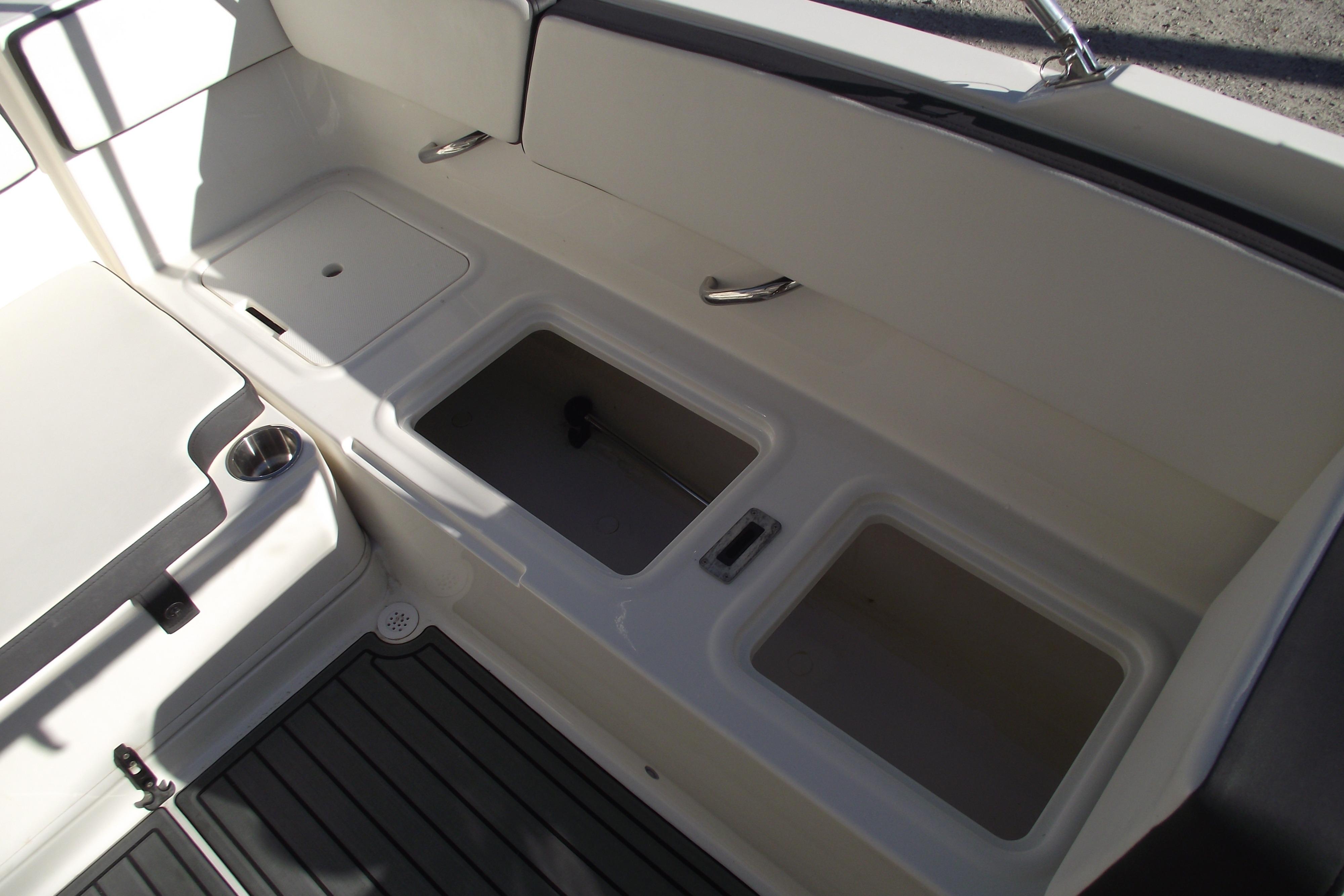 2022 Bayliner VR4 Bowrider OB interior storage compartments and seating area.