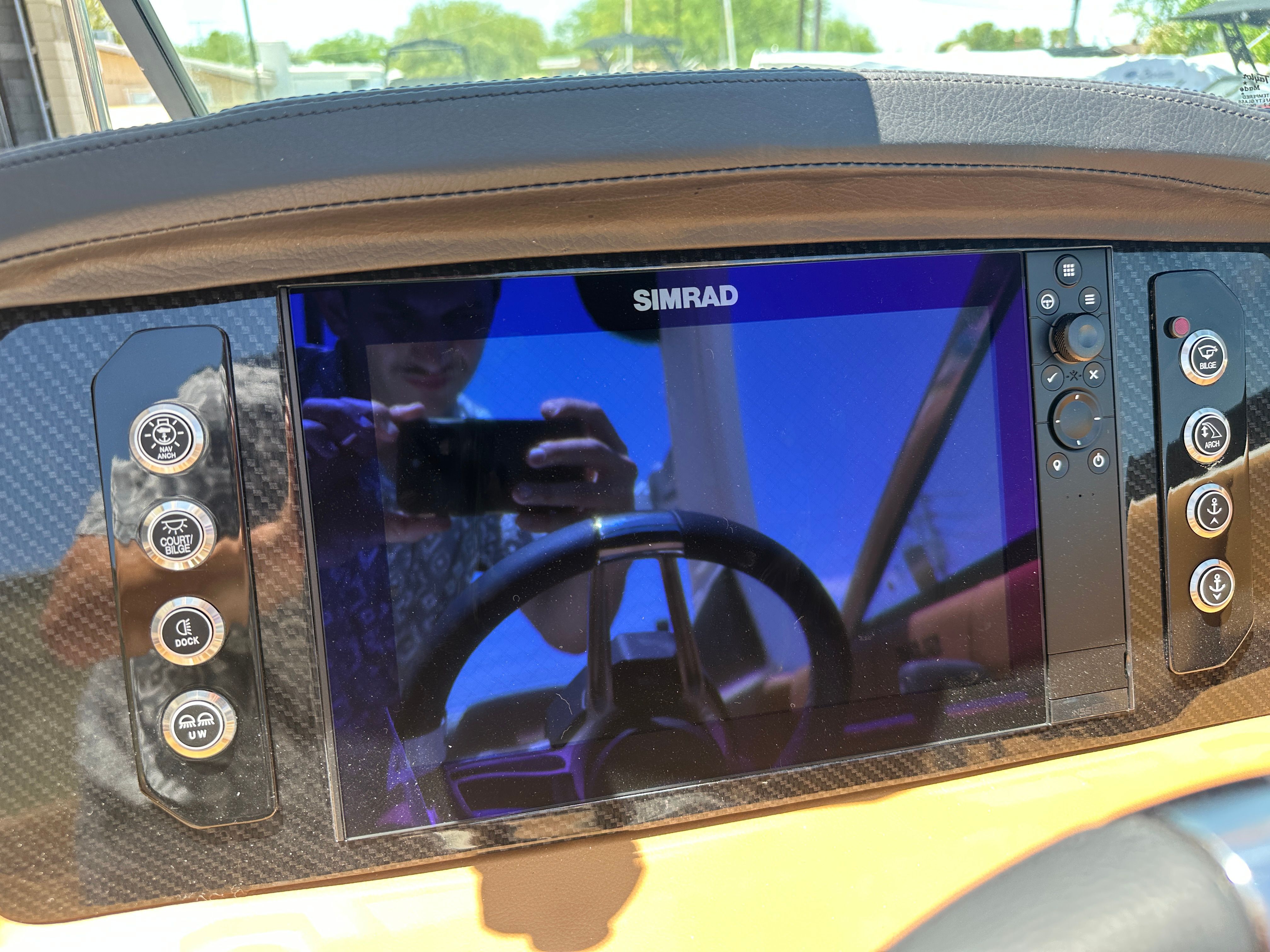 The image shows a Simrad display on a Chaparral 26 Surf boat.