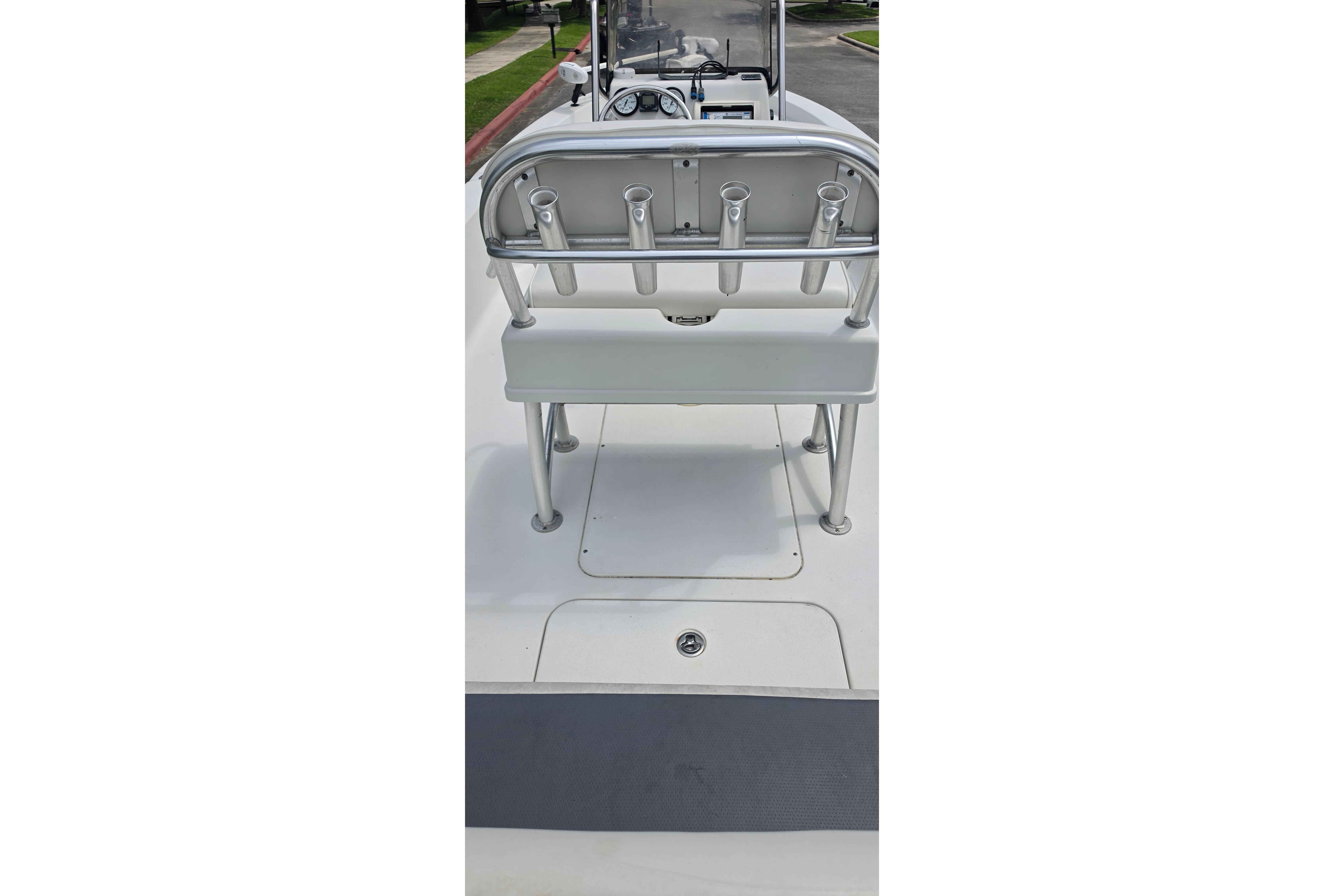 2009 Ranger 2200 Bay Ranger boat interior with rod holders and seating.