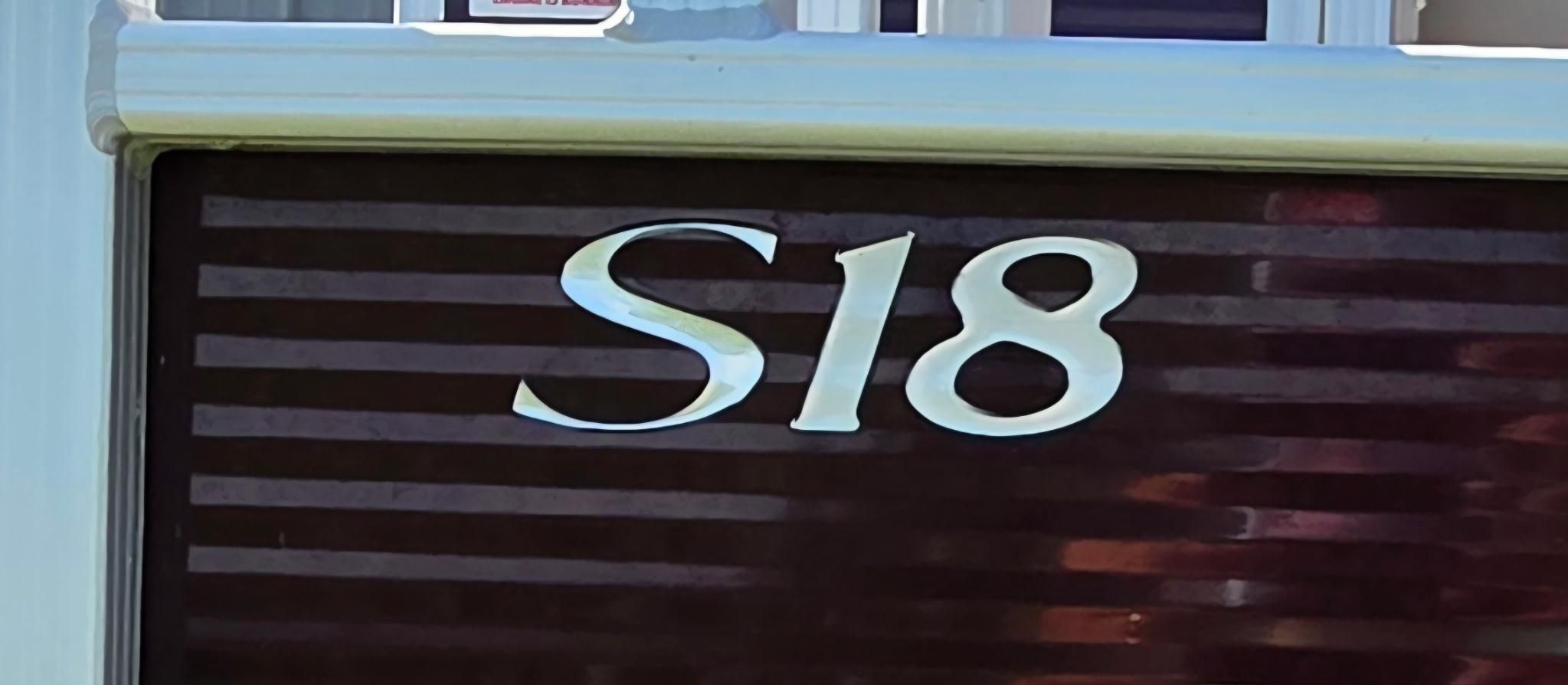 Close-up of the "S18" lettering on a Bennington boat.