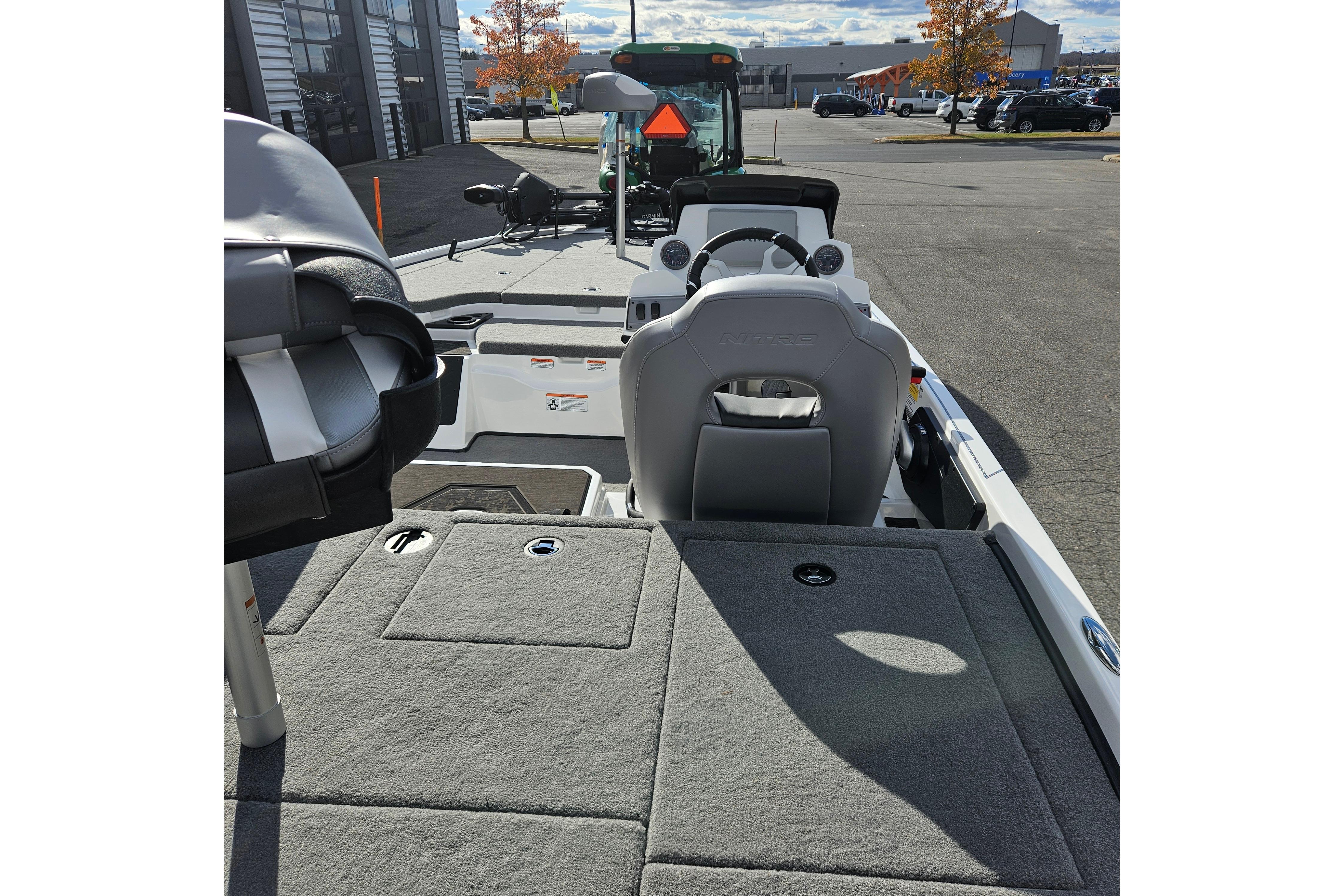 2026 Nitro Z19 XL Pro boat interior with steering console and seating.