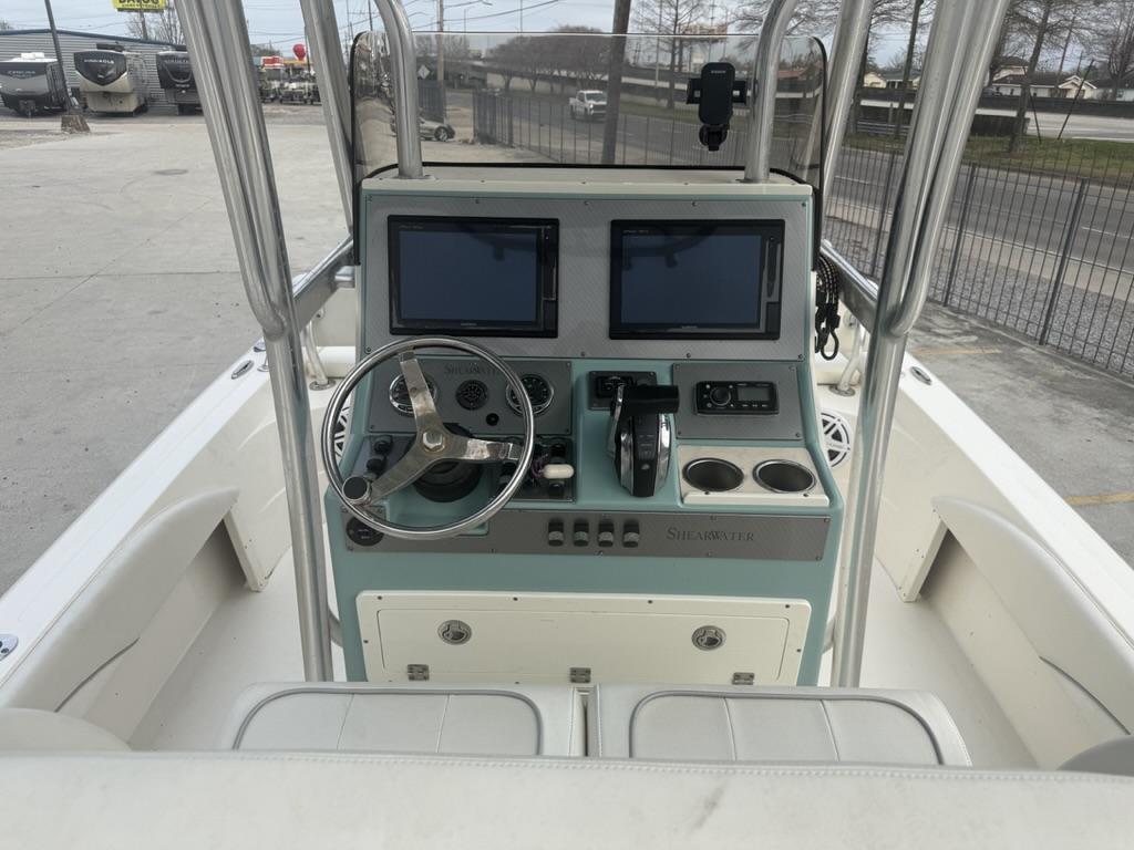 2017 ShearWater 270 Carolina Flare boat console with dual screens and steering wheel.