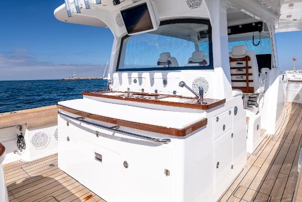 2020 HCB 53 Sueños yacht deck with luxurious seating and ocean view.