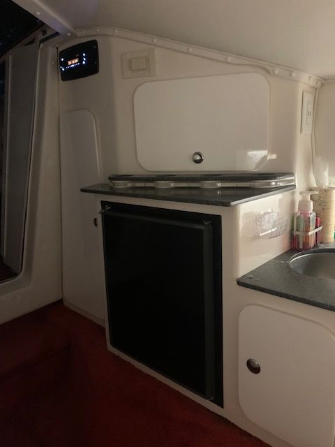 Interior of a 2001 Fountain Lightning yacht kitchen.