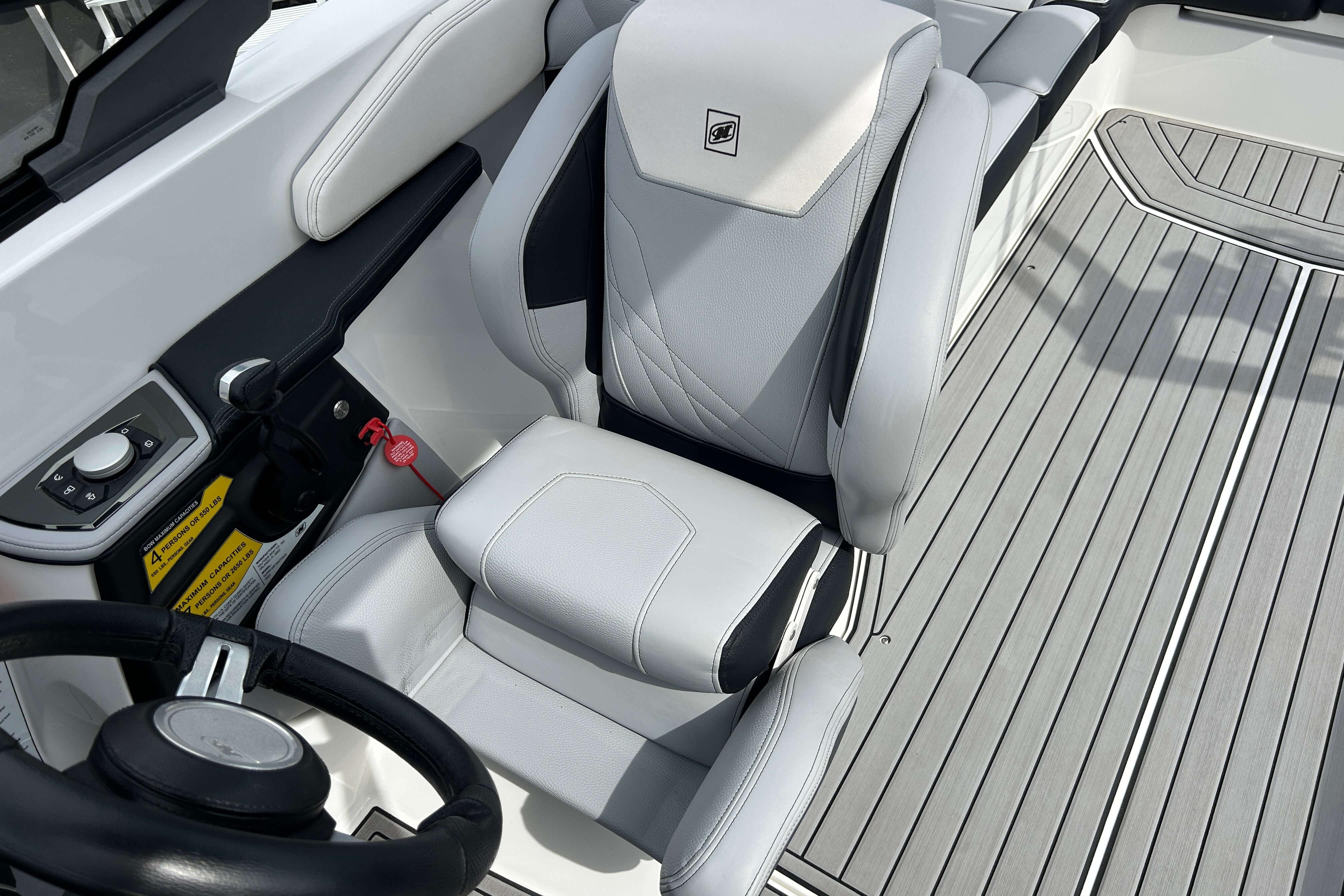 2021 Nautique Super Air Nautique GS24 boat interior with sleek seating and modern controls.