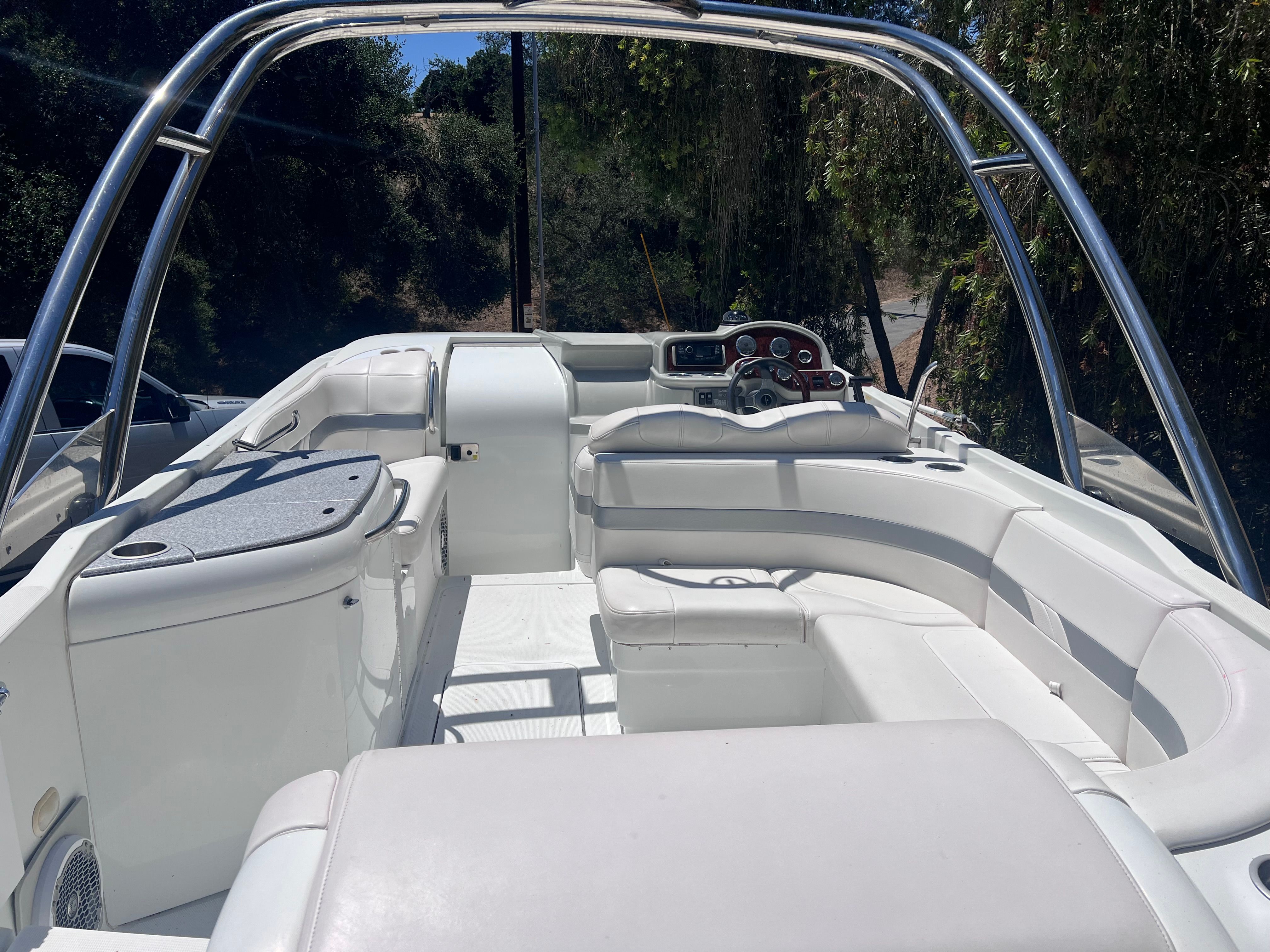 Interior of a 2006 Formula 260 Sun Sport boat, white upholstery.