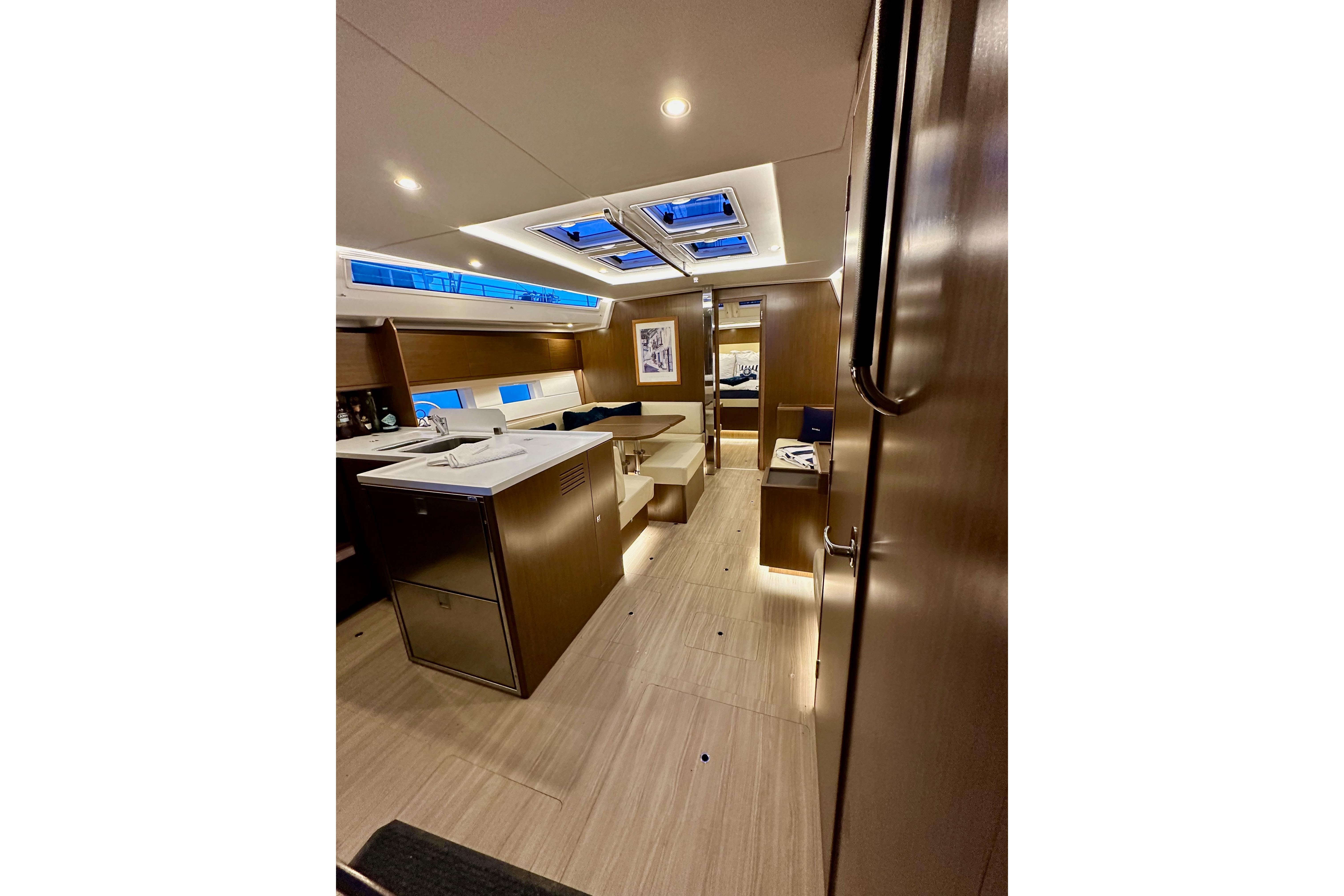 Luxurious interior of 2020 Bavaria C50 yacht with modern design and ambient lighting.