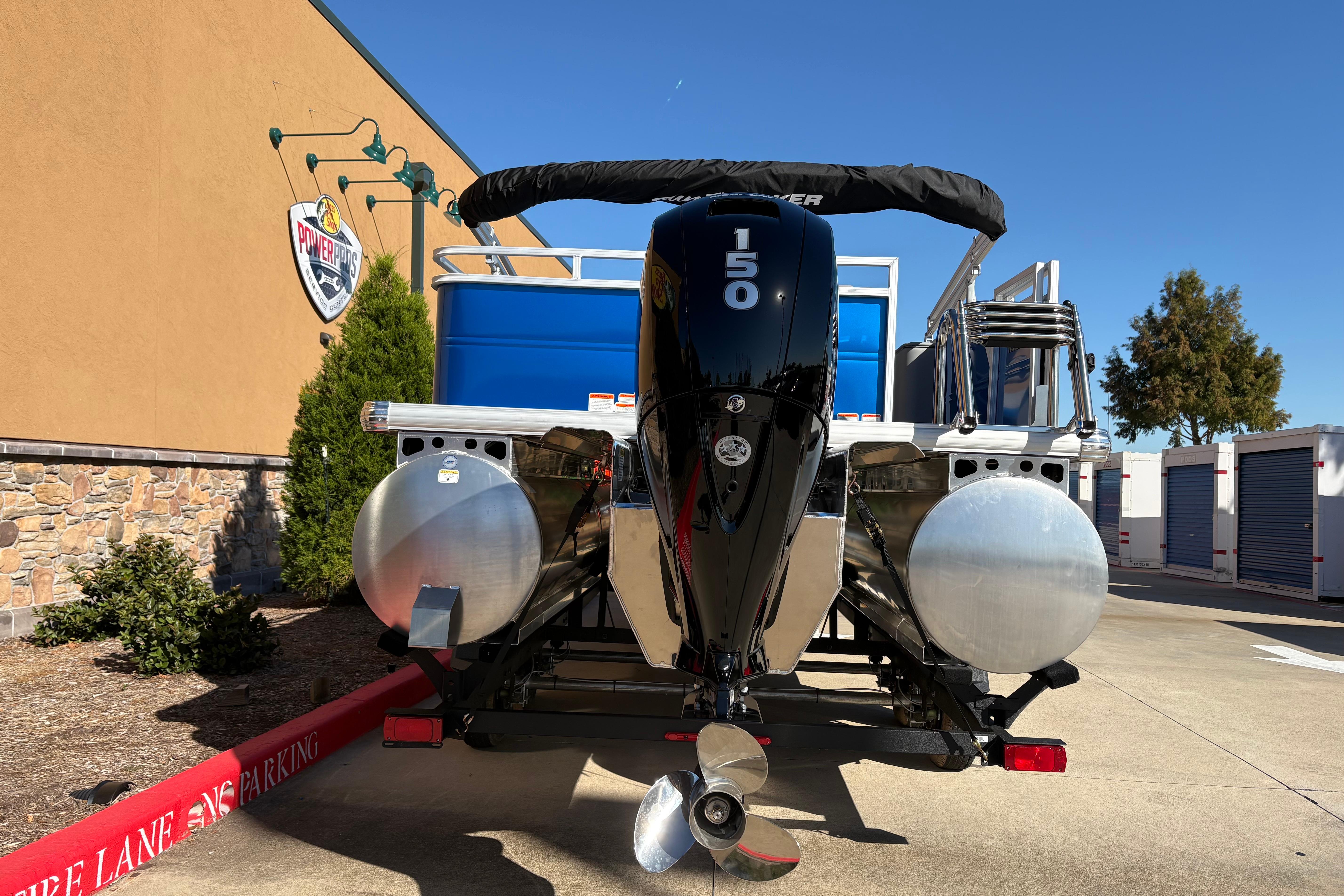 2026 Sun Tracker Party Barge 22 RF XP3 pontoon boat with powerful 150 HP engine.