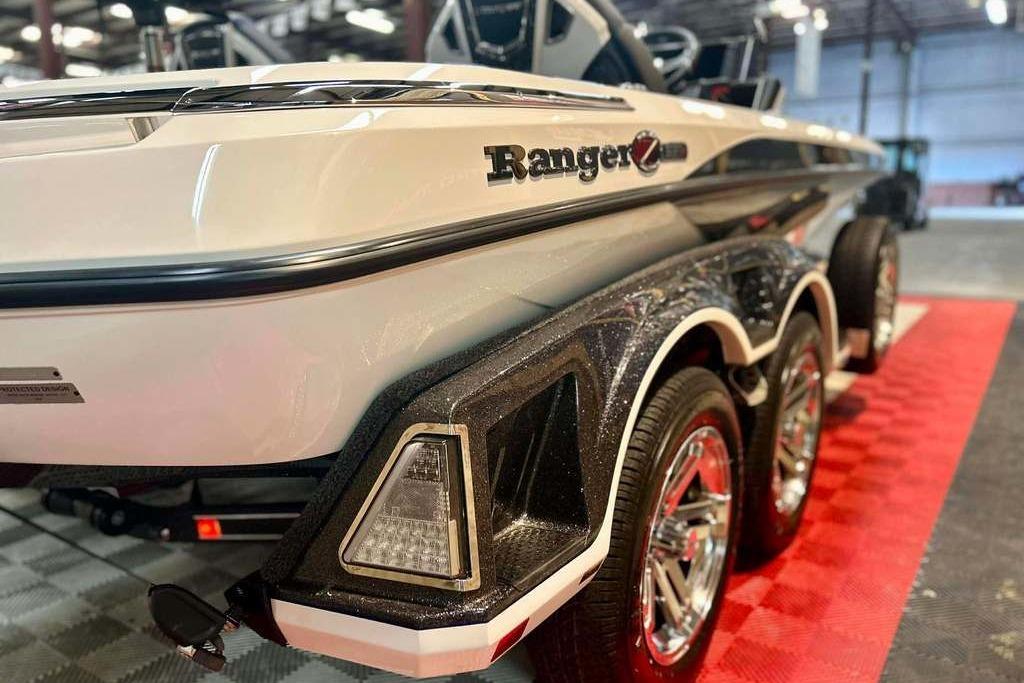2026 Ranger Z521R Cup-Equipped boat on display, showcasing sleek design and triple-axle trailer.