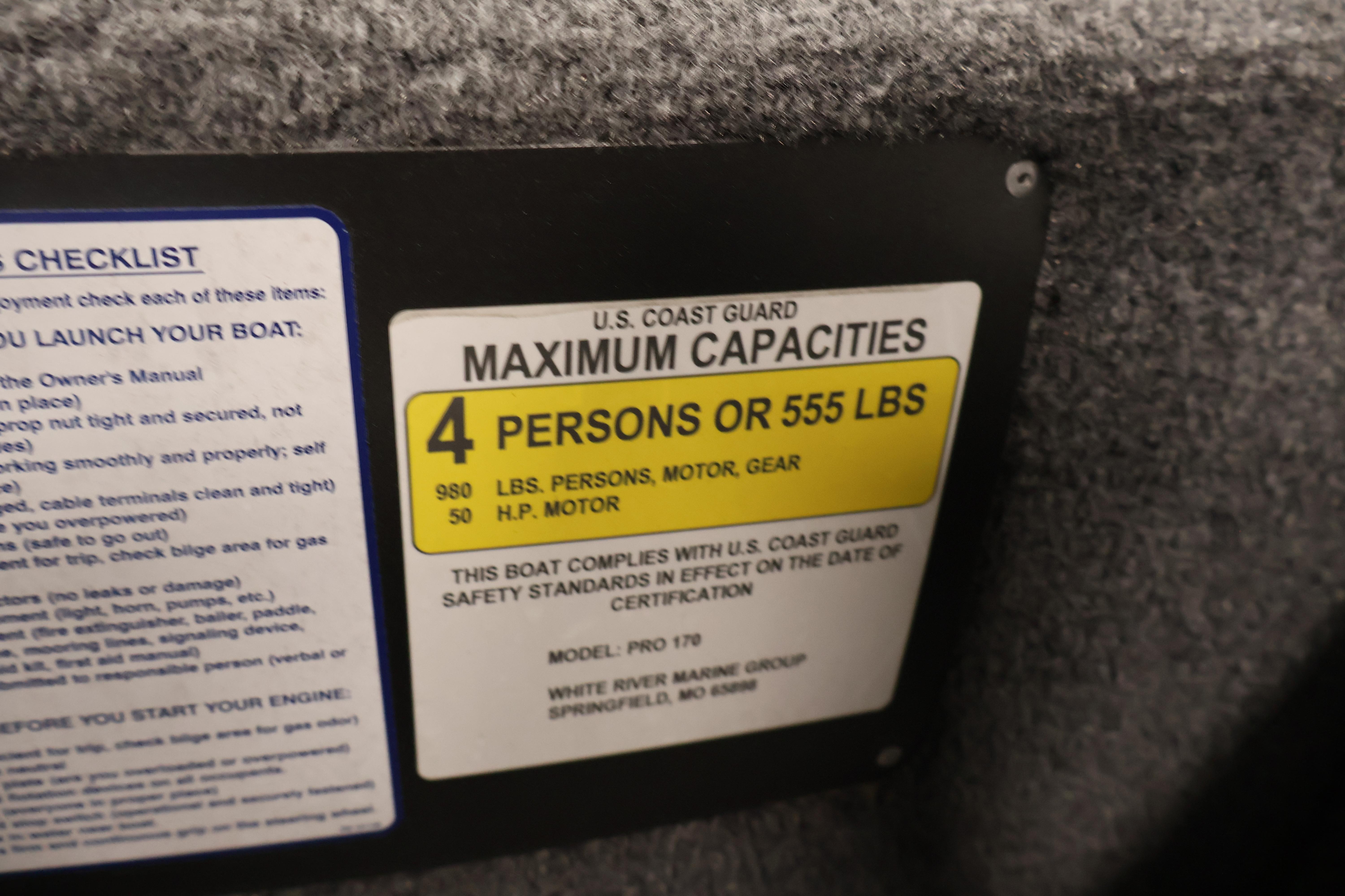 2024 Tracker Pro 170 capacity label: 4 persons or 555 lbs, U.S. Coast Guard compliant.