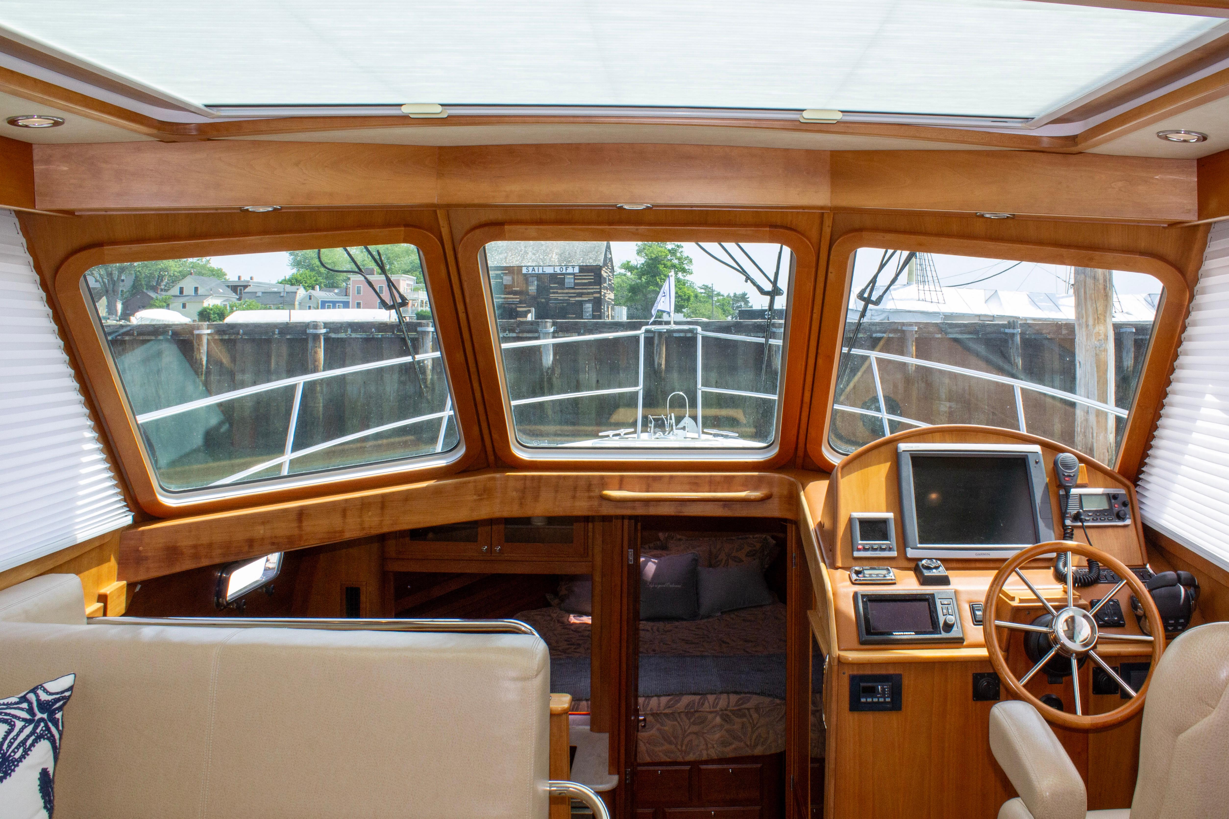 Interior view of 2013 Sabre 38 Salon Express yacht, featuring helm and navigation equipment.