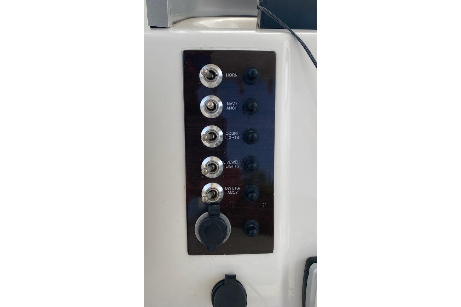 Control panel of a 2017 Robalo R222 Center Console boat with labeled switches.