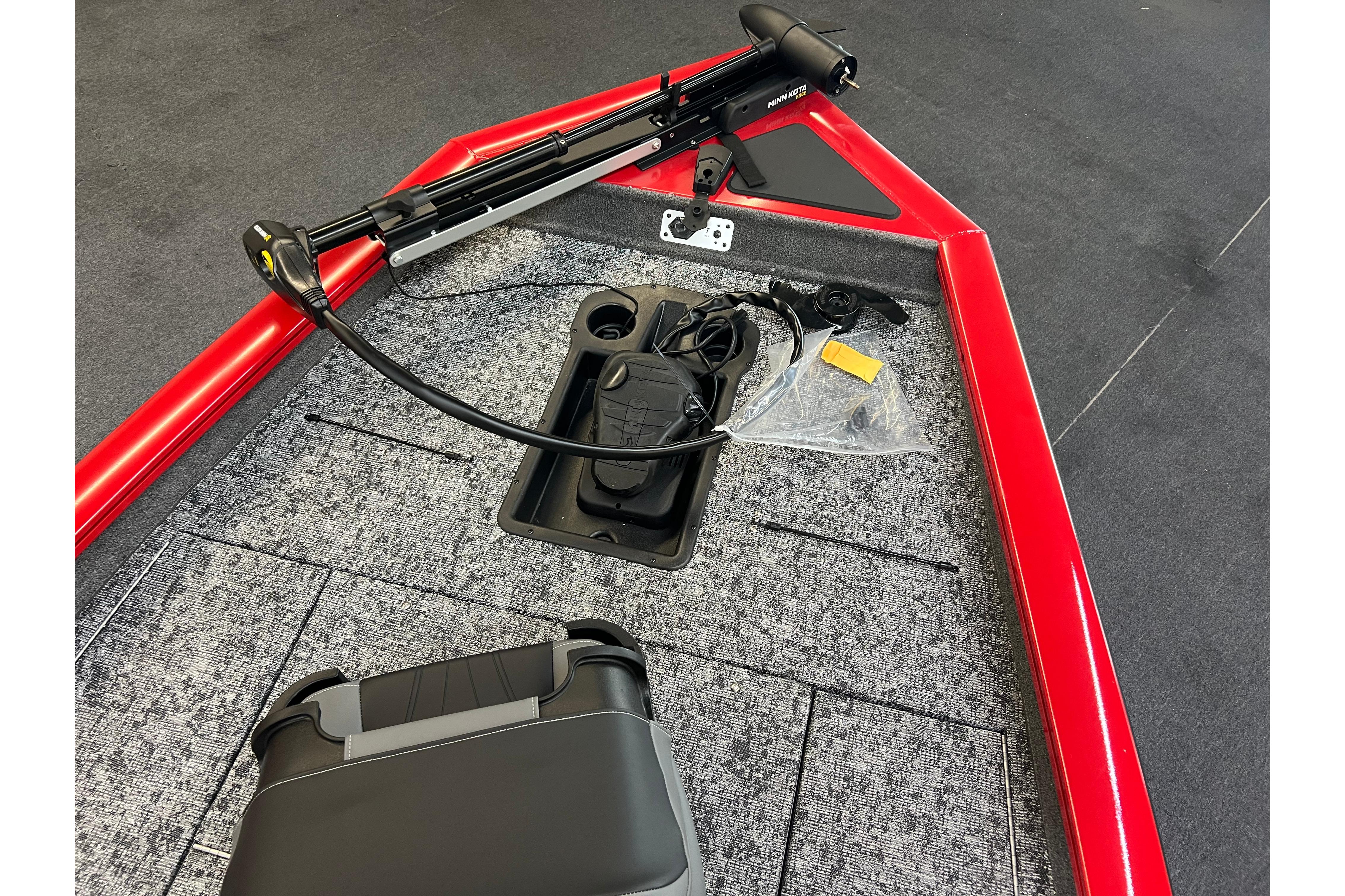 2026 Tracker Pro Team 190 boat deck with trolling motor and red trim.