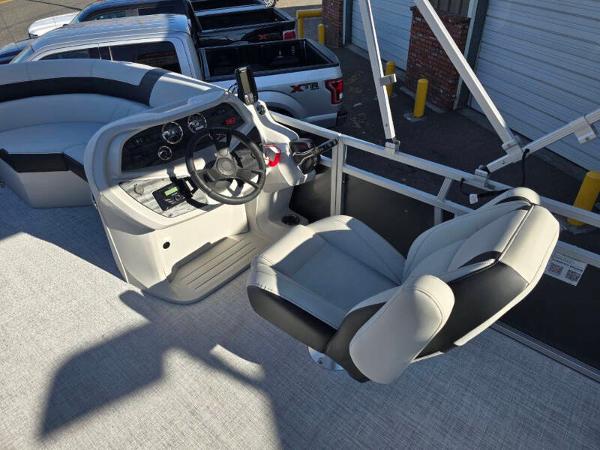 2025 Berkshire 20 CL boat interior with steering wheel and captain's chair.