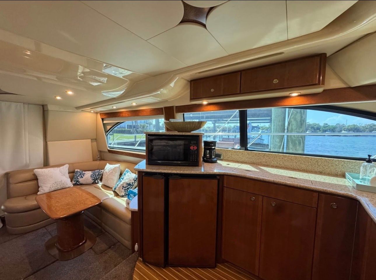 Interior of a 2007 Meridian 411 Sedan yacht with kitchen and seating area.