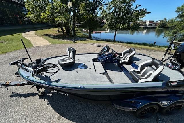 2026 Nitro Z18 Pro boat on trailer by a lake, featuring sleek design and modern seating.