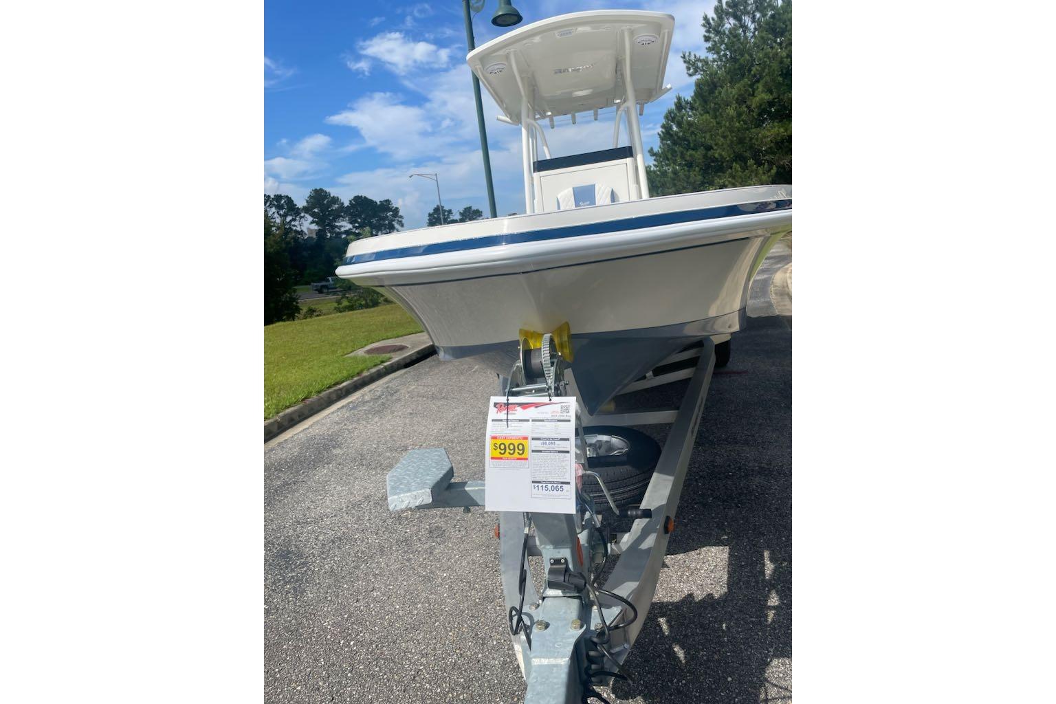 2025 Ranger 2360 Bay boat on trailer, displayed outdoors with price tag.