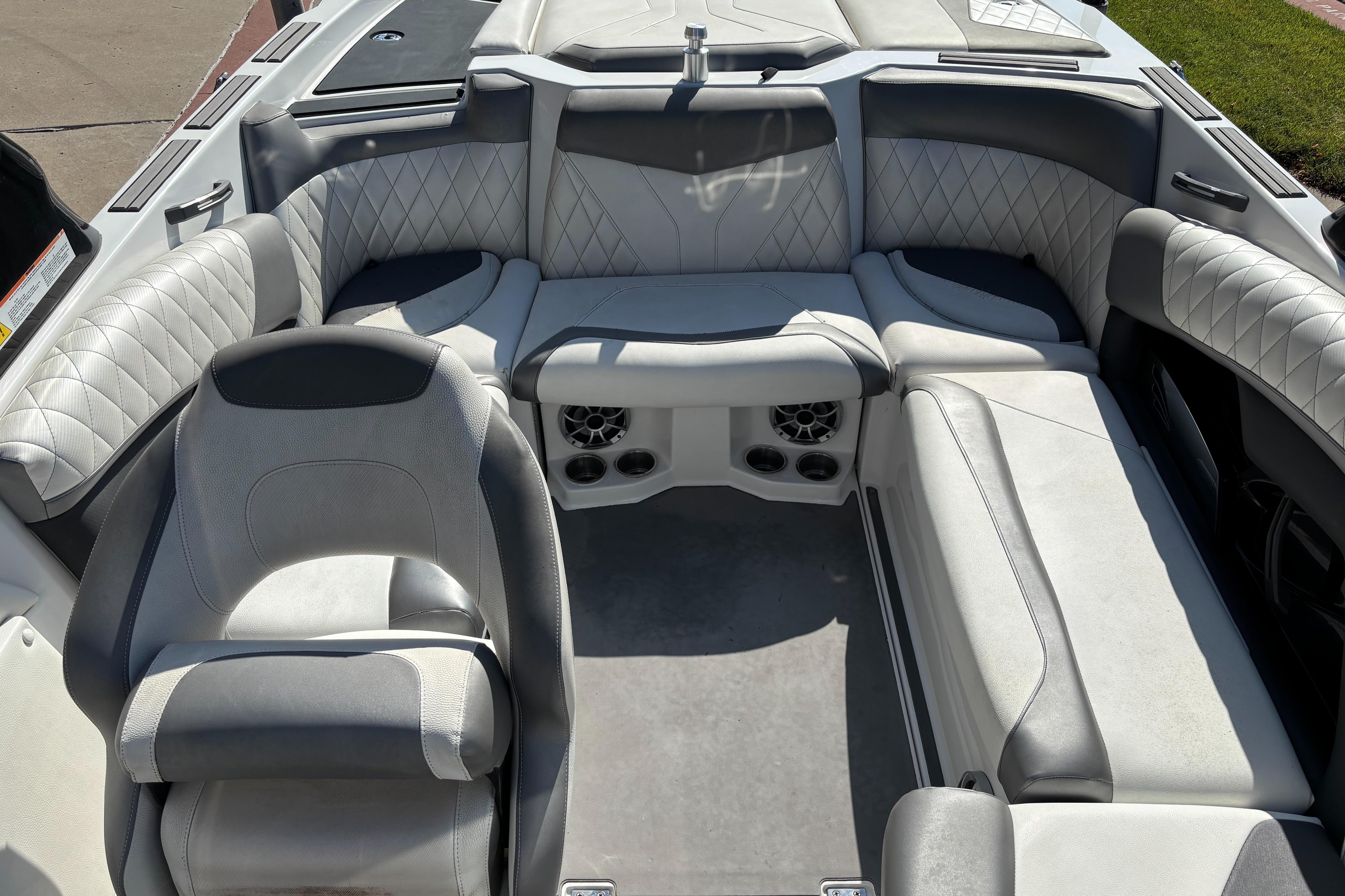 2014 Tigé RZR boat interior with gray quilted seating and modern design.