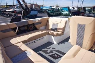 2025 MasterCraft XT20 boat interior with beige seating and modern design.