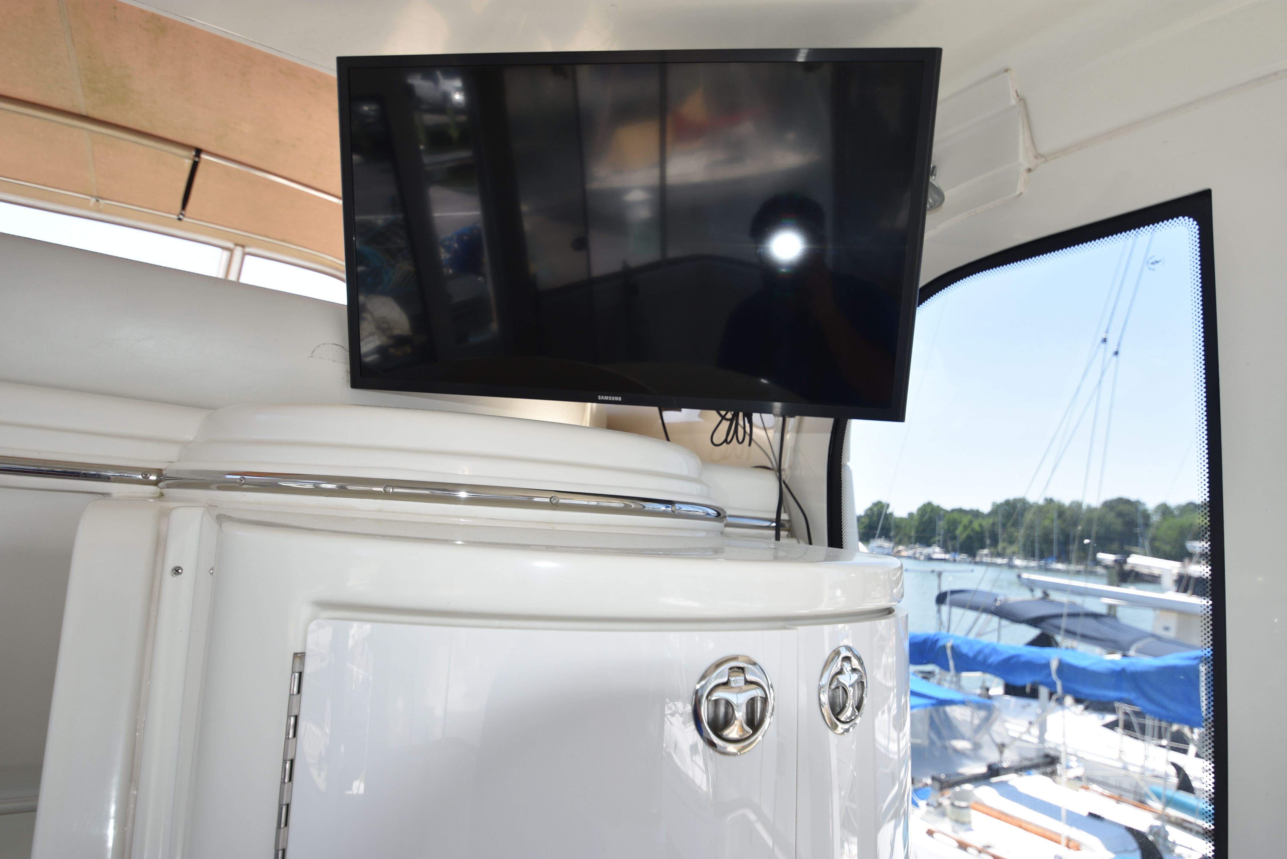 A TV is mounted in the cabin of a 2004 Carver 466 Motor Yacht.
