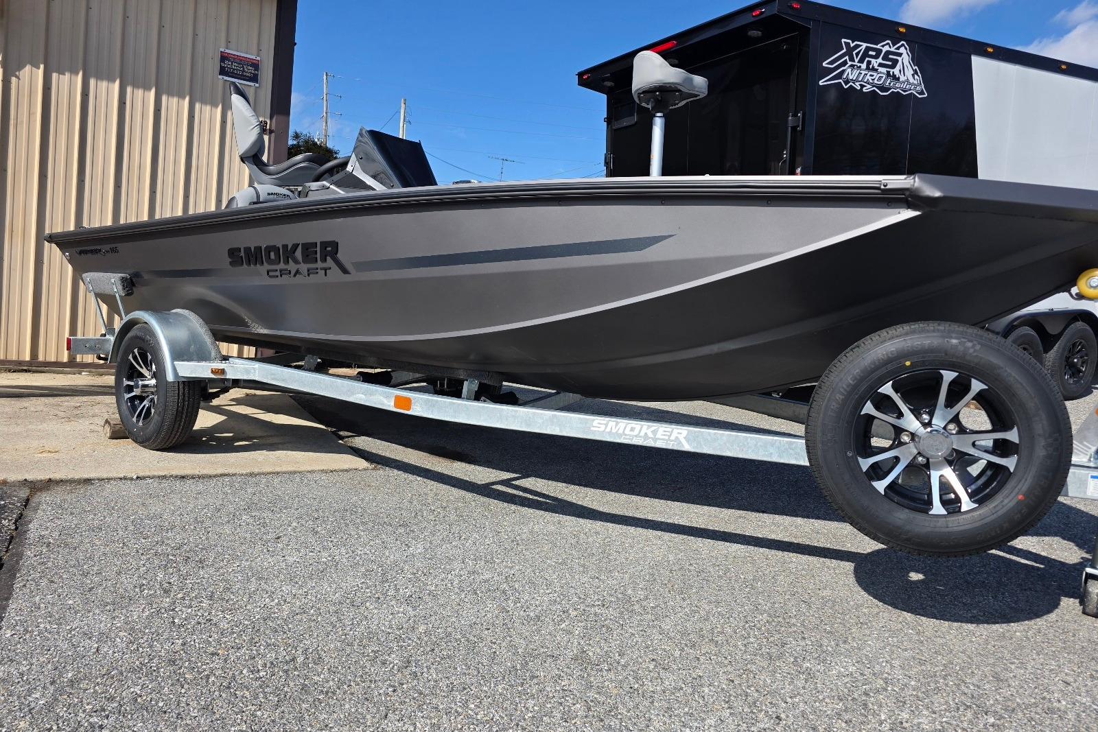 2026 Smoker Craft Viper 165 boat on trailer, parked outdoors.