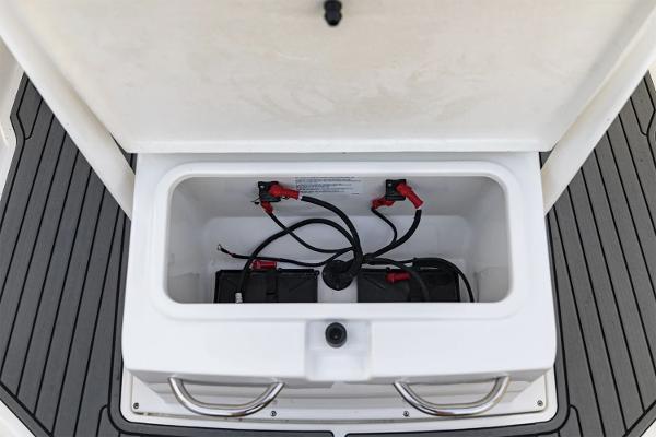 Manufacturer Provided Image: 2025 Bayliner Trophy T22CC boat battery compartment with wiring and connections.
