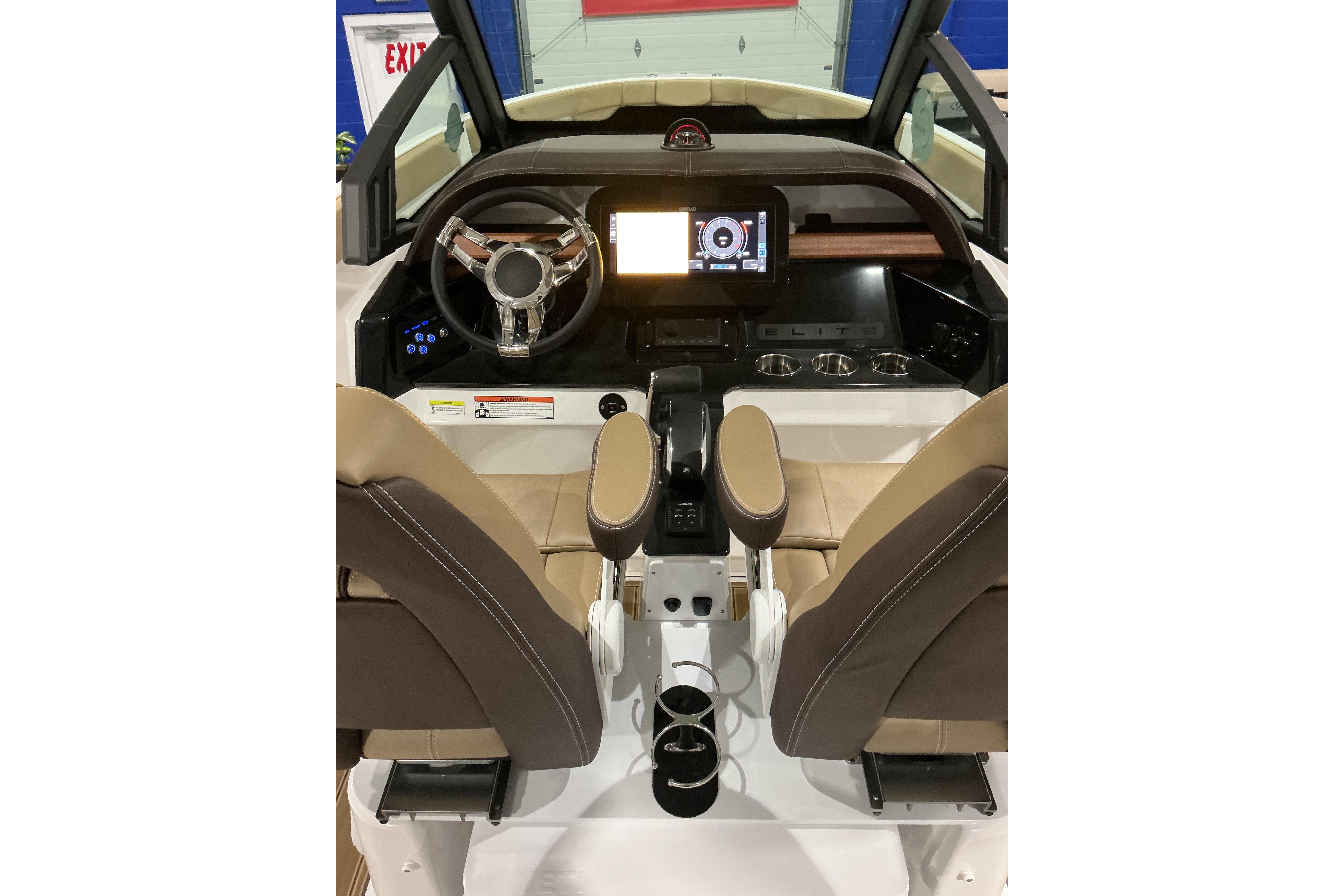 2026 Monterey Elite 25 SD boat interior with modern dashboard and steering wheel.