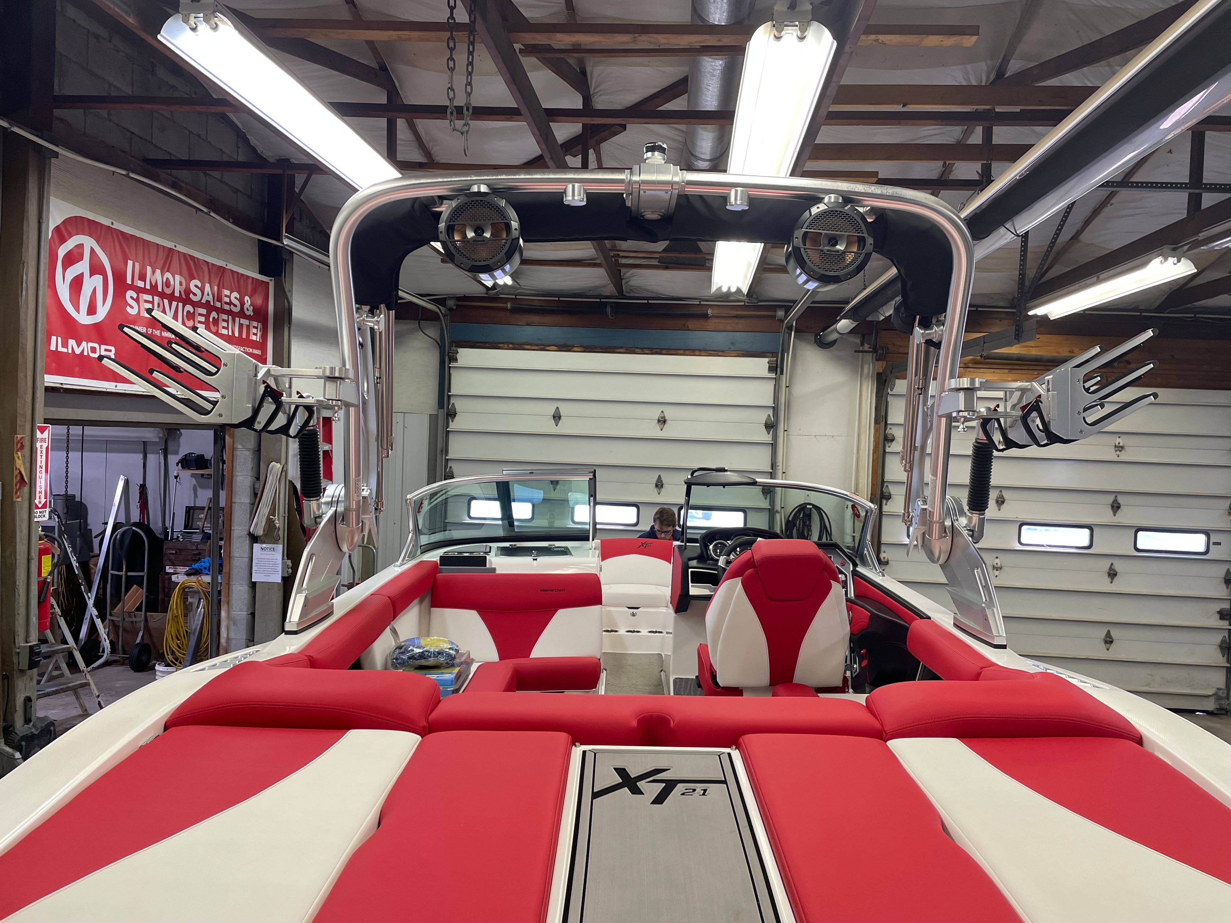 Interior view of a 2019 Master XT21 boat in a workshop.