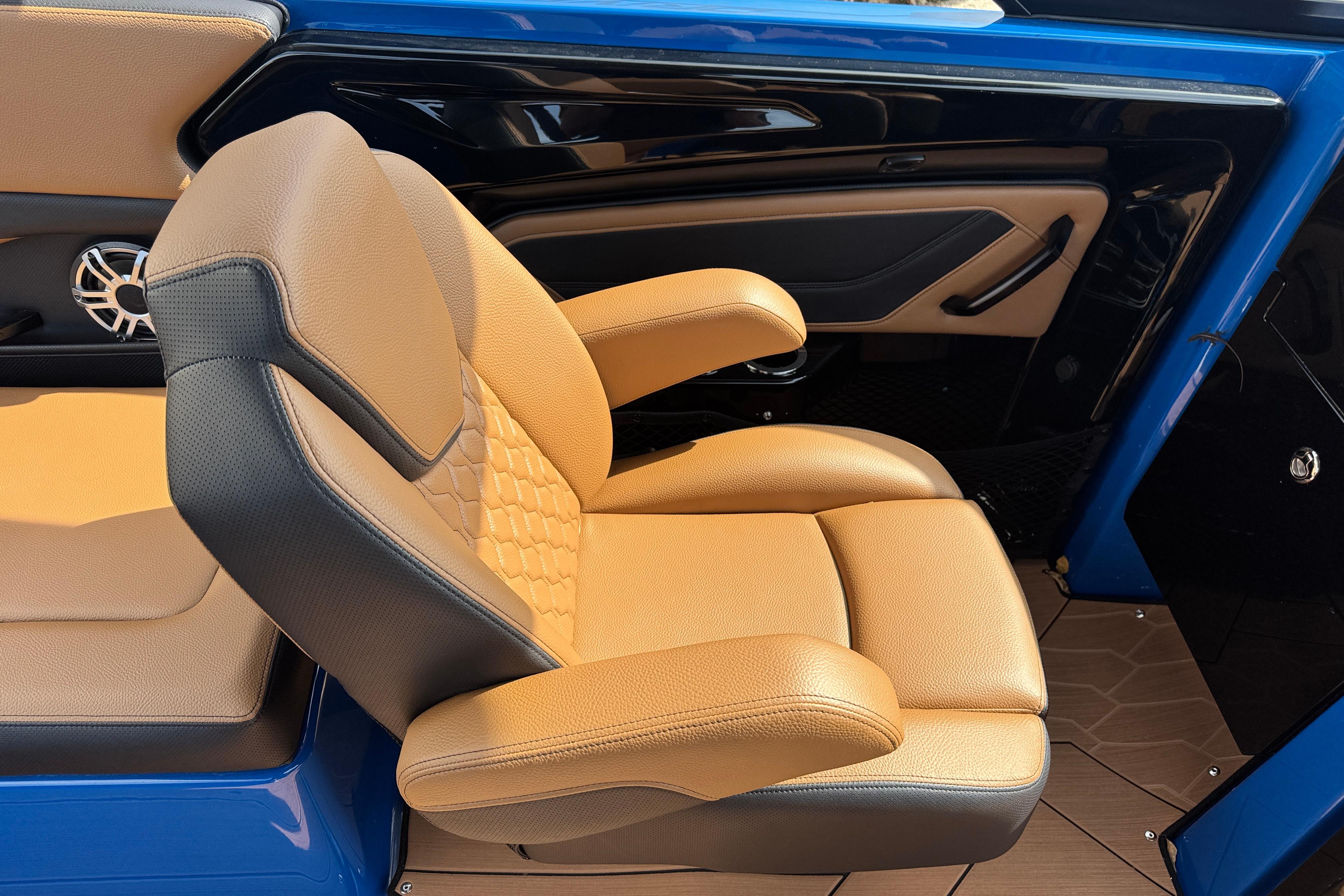 Luxurious tan and black seating in 2026 Yamaha Boats 255XD, showcasing premium design and comfort.