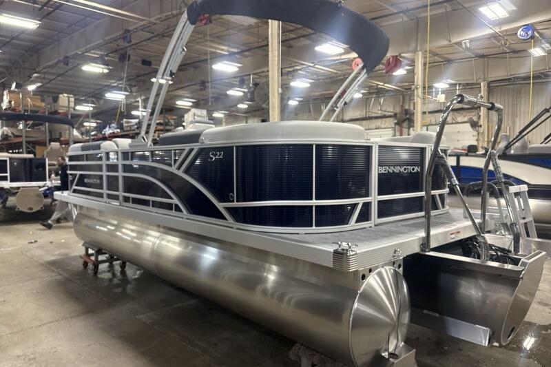 2026 Bennington 22 SSRSF pontoon boat in a warehouse setting.