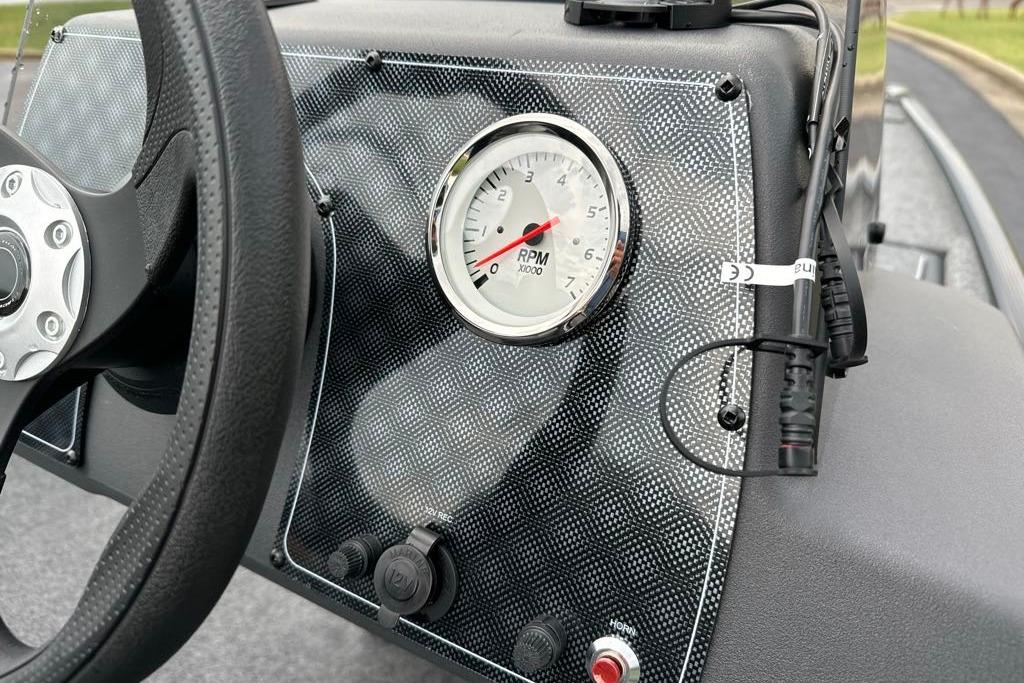 Dashboard of 2026 Tracker Bass Tracker Classic XL with RPM gauge and steering wheel.