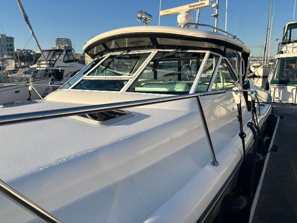 2003 Tiara Yachts 3500 Open docked, showcasing sleek design and spacious deck.