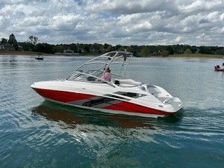 2008 Yamaha AR230 boat on calm water under cloudy skies.