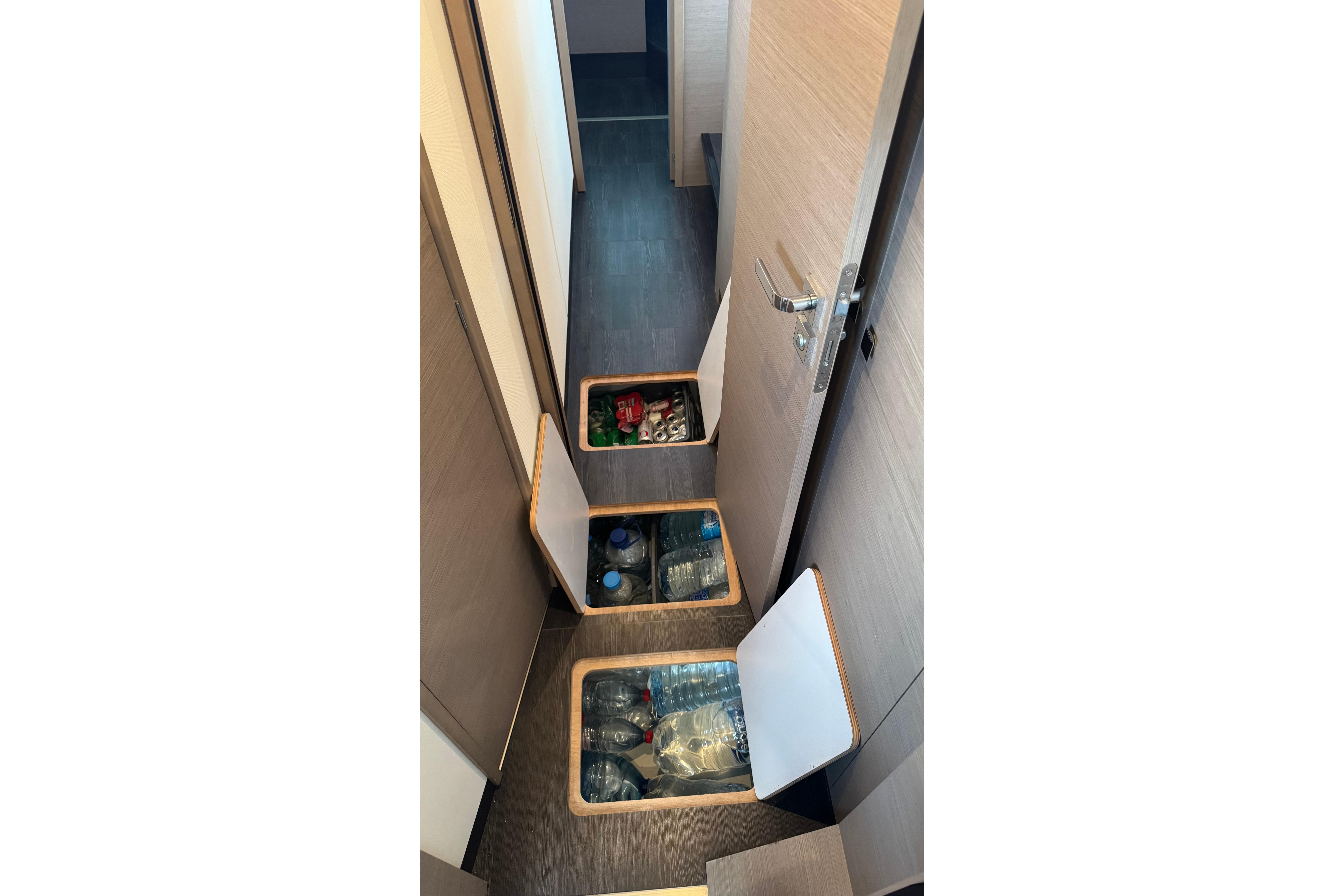 Storage compartments in the hallway of a 2020 Fountaine Pajot Saona 47 yacht.