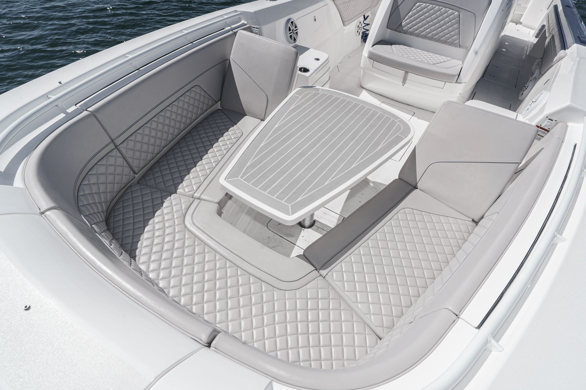 Intrepid 375 NOMAD 2021 featuring luxurious seating area and table.