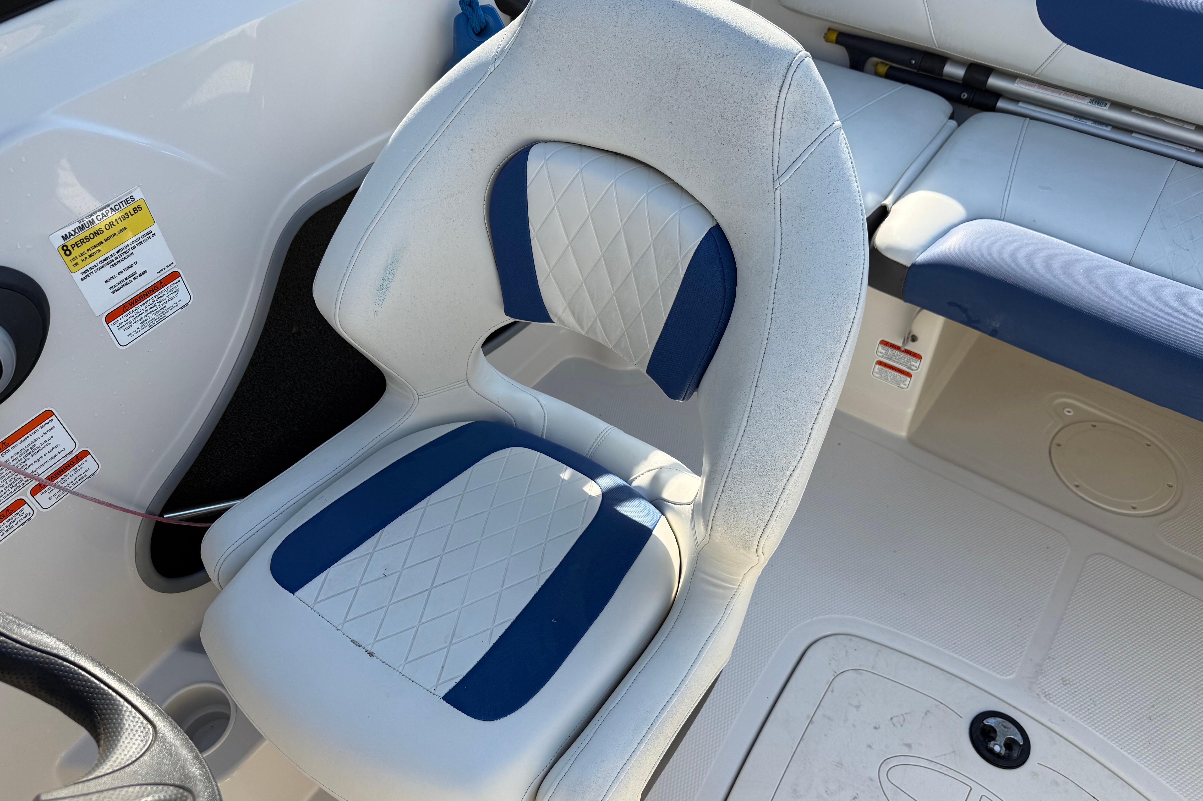 White and blue seating in a 2016 Tahoe 450 TS boat interior.