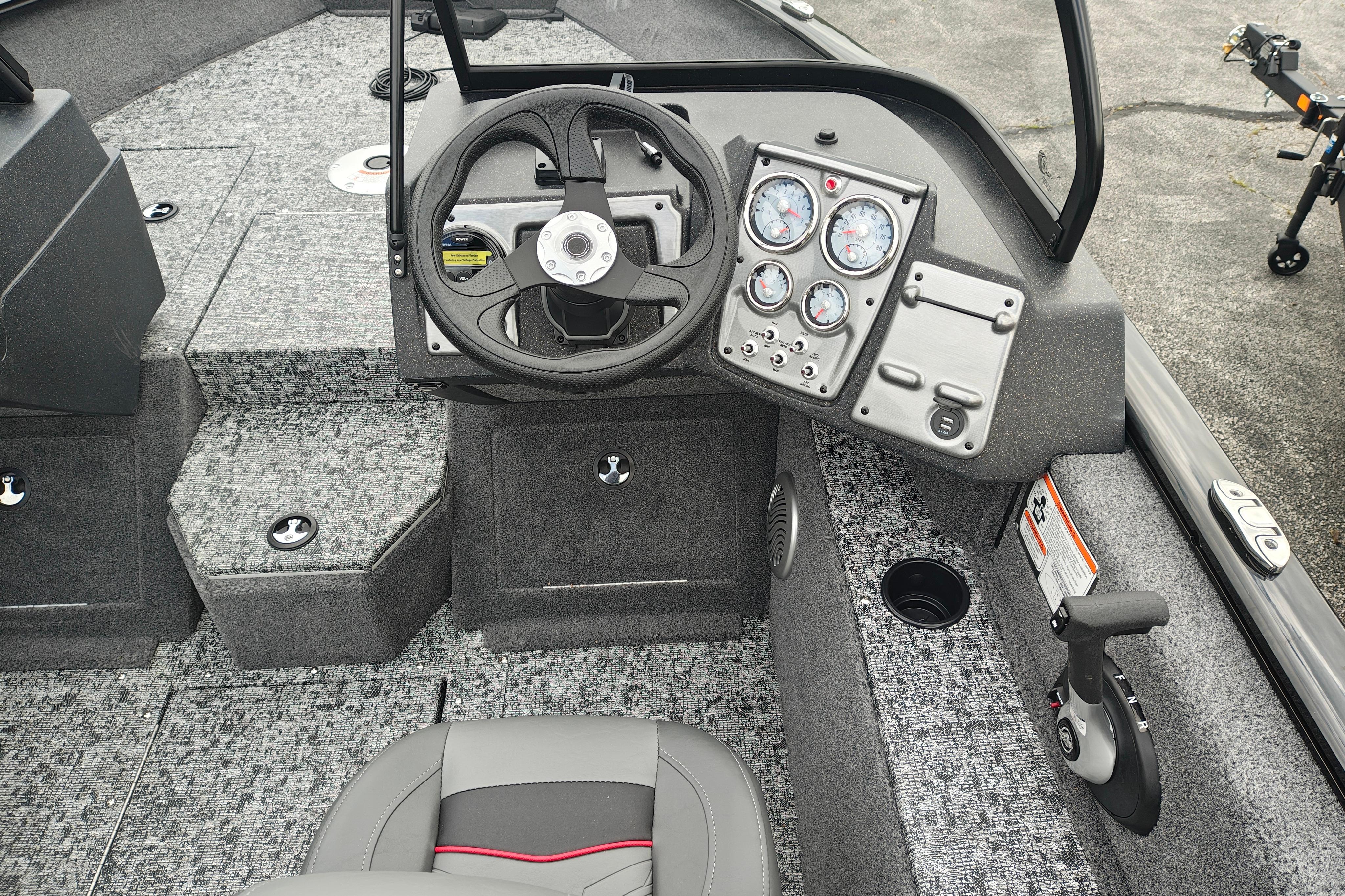 2026 Tracker Pro Guide V-175 WT boat interior with steering wheel and control panel.