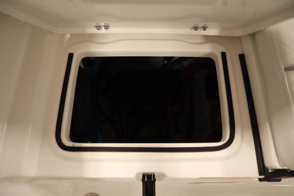 2025 Sea Fox 228 Traveler boat storage compartment with secure latch and rubber seal.