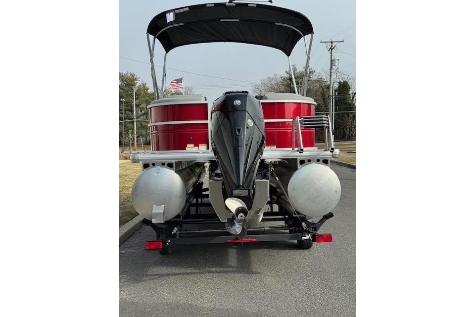 2026 Sun Tracker Party Barge 24 XP3 pontoon boat with outboard motor and canopy.