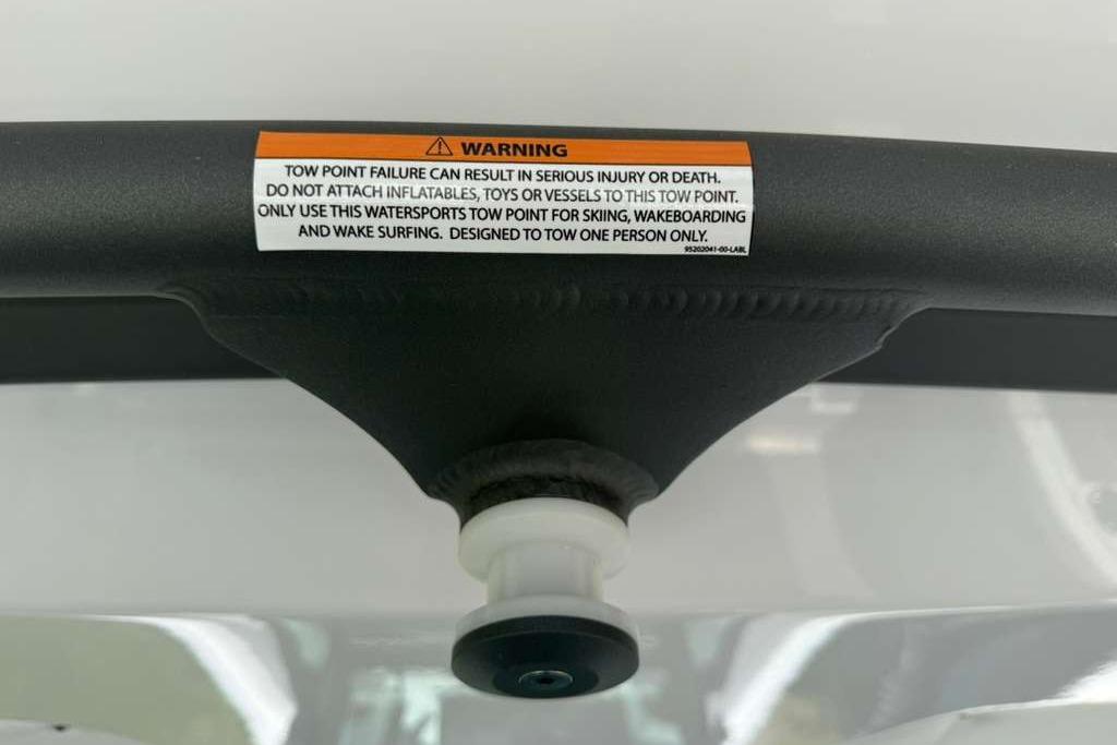Warning label on 2026 Monterey Elite 30 OB tow point for watersports safety.