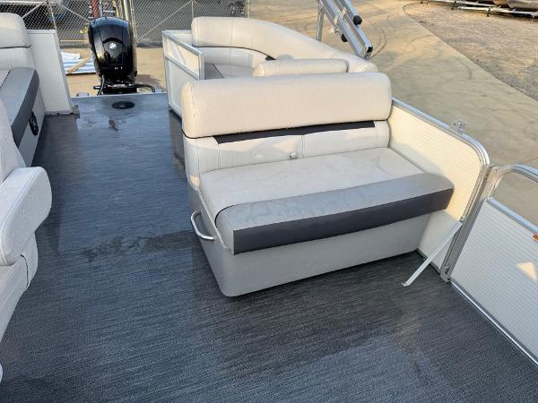 2022 Godfrey 2286 pontoon boat with gray seating and outboard motor.