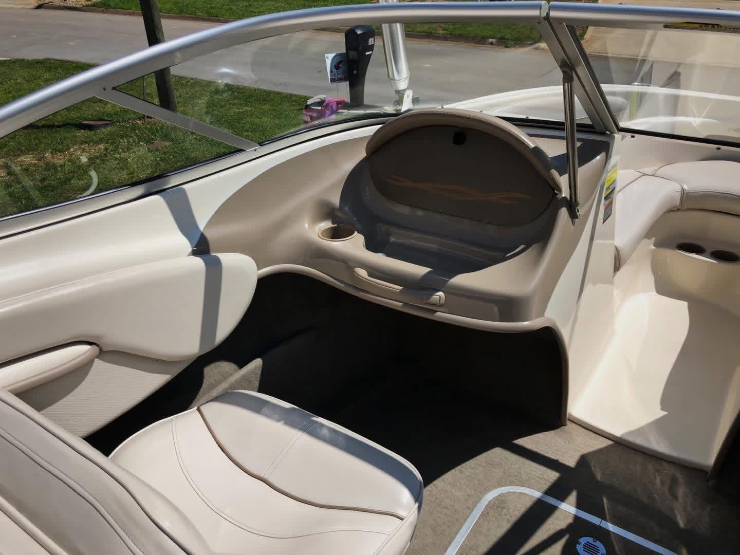 Interior of a 1999 Maxum 1800 SR boat, beige upholstery.