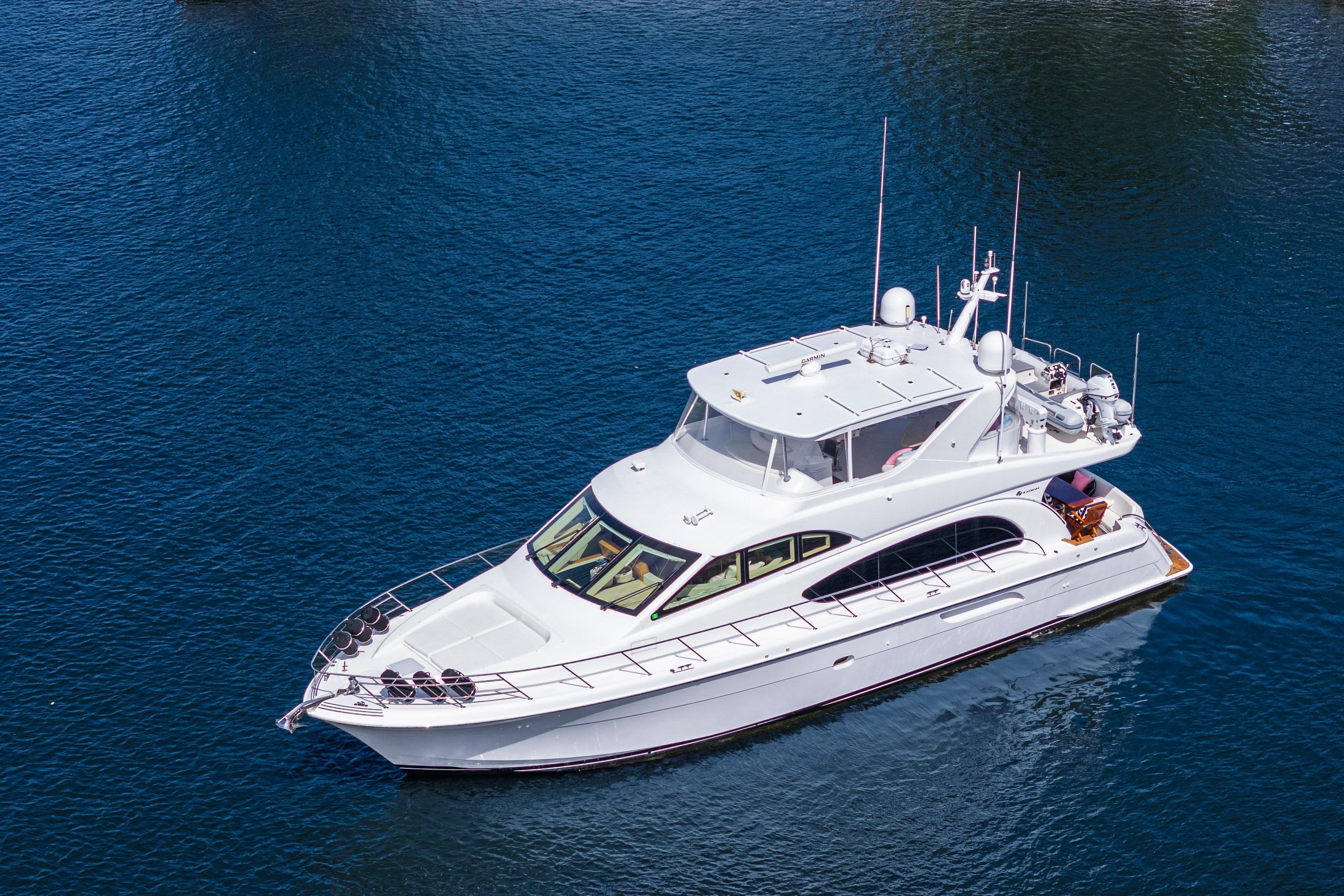 2008 Hatteras 64 Motor Yacht cruising on calm blue waters.