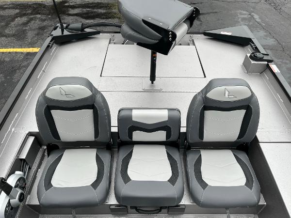 2024 Lowe Legacy boat interior with three gray and white seats.