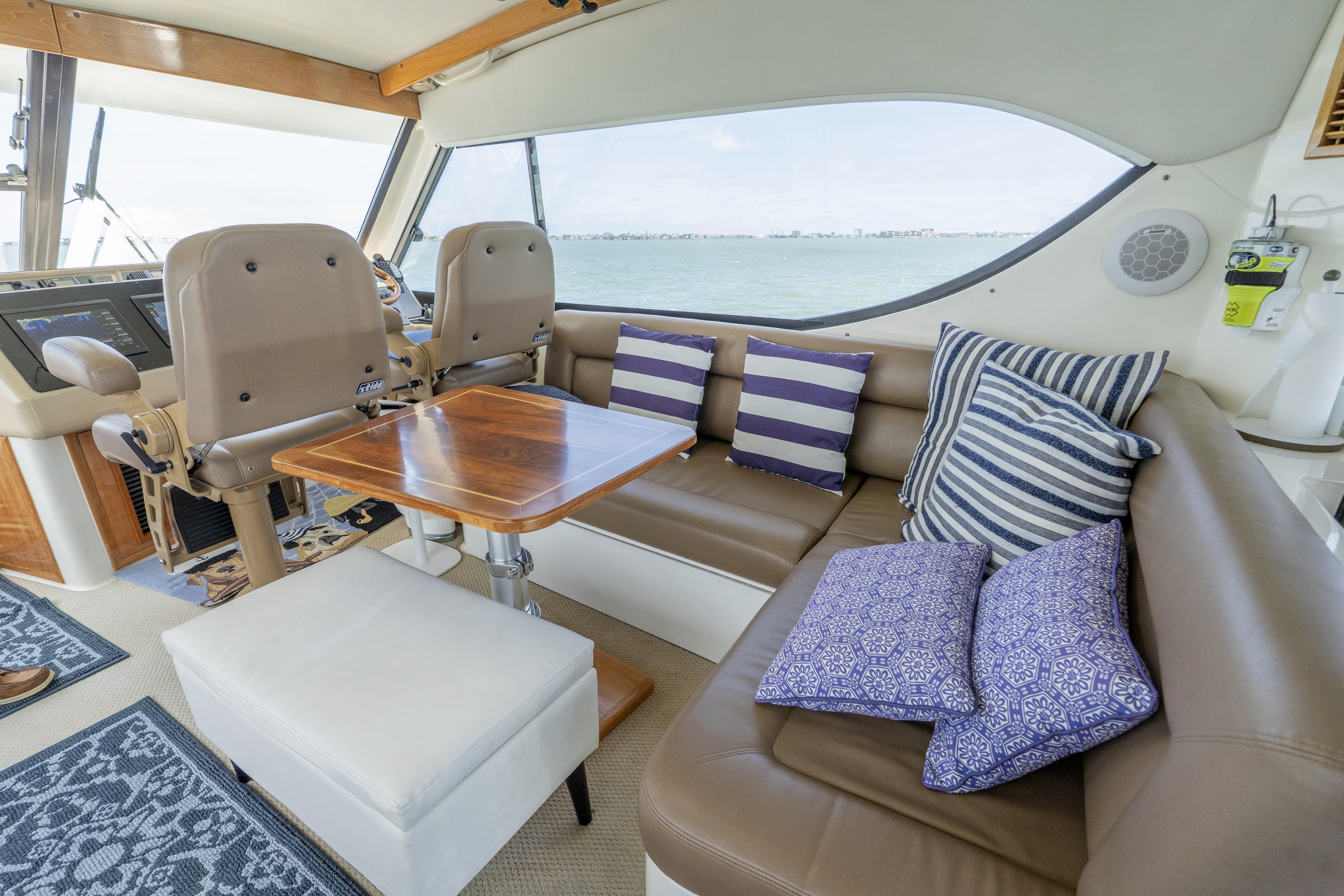 Luxurious interior of 2008 Maritimo 52 yacht with plush seating and nautical decor.