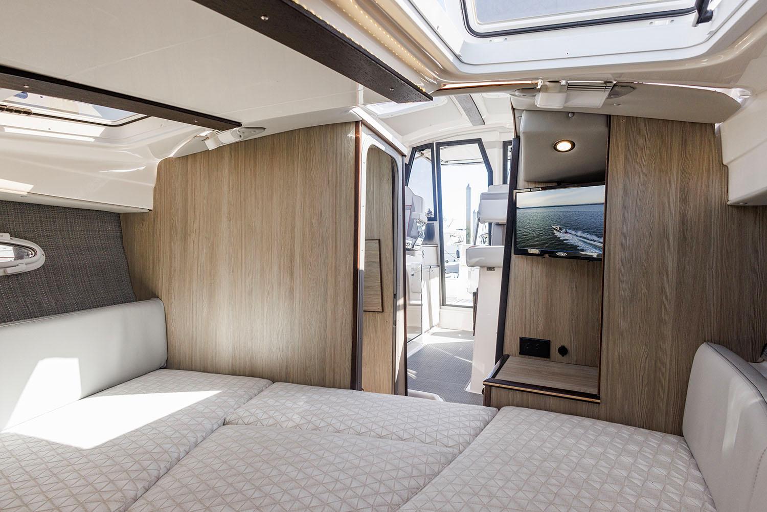Manufacturer Provided Image: Luxurious interior of 2025 Solara S-250 Coupe with modern design and comfortable bedding.
